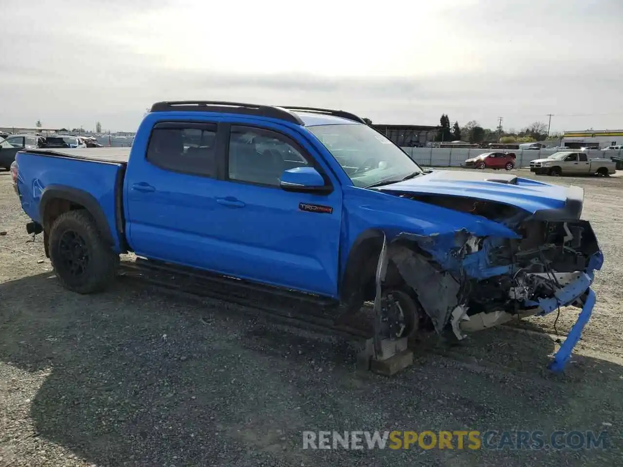 4 Photograph of a damaged car 5TFCZ5AN2KX185897 TOYOTA TACOMA 2019