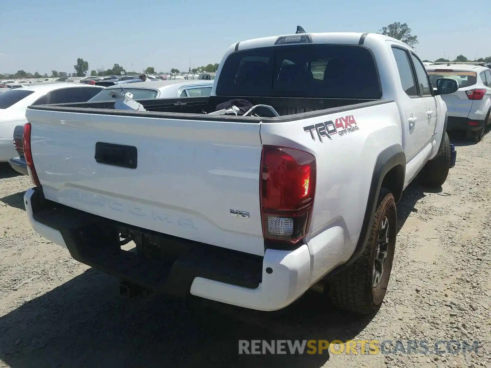 4 Photograph of a damaged car 5TFCZ5AN2KX197791 TOYOTA TACOMA 2019