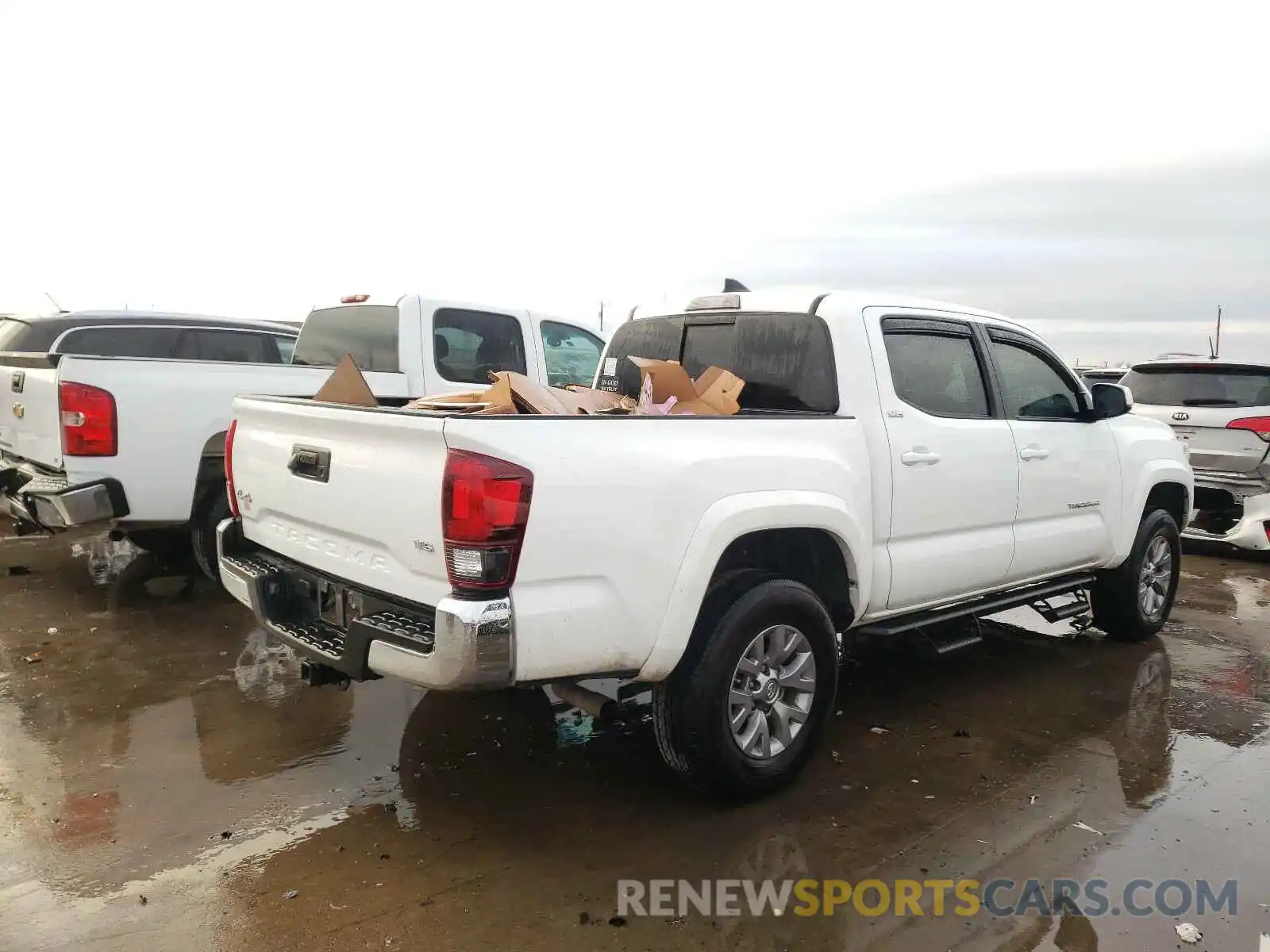 4 Photograph of a damaged car 5TFCZ5AN2KX203833 TOYOTA TACOMA 2019