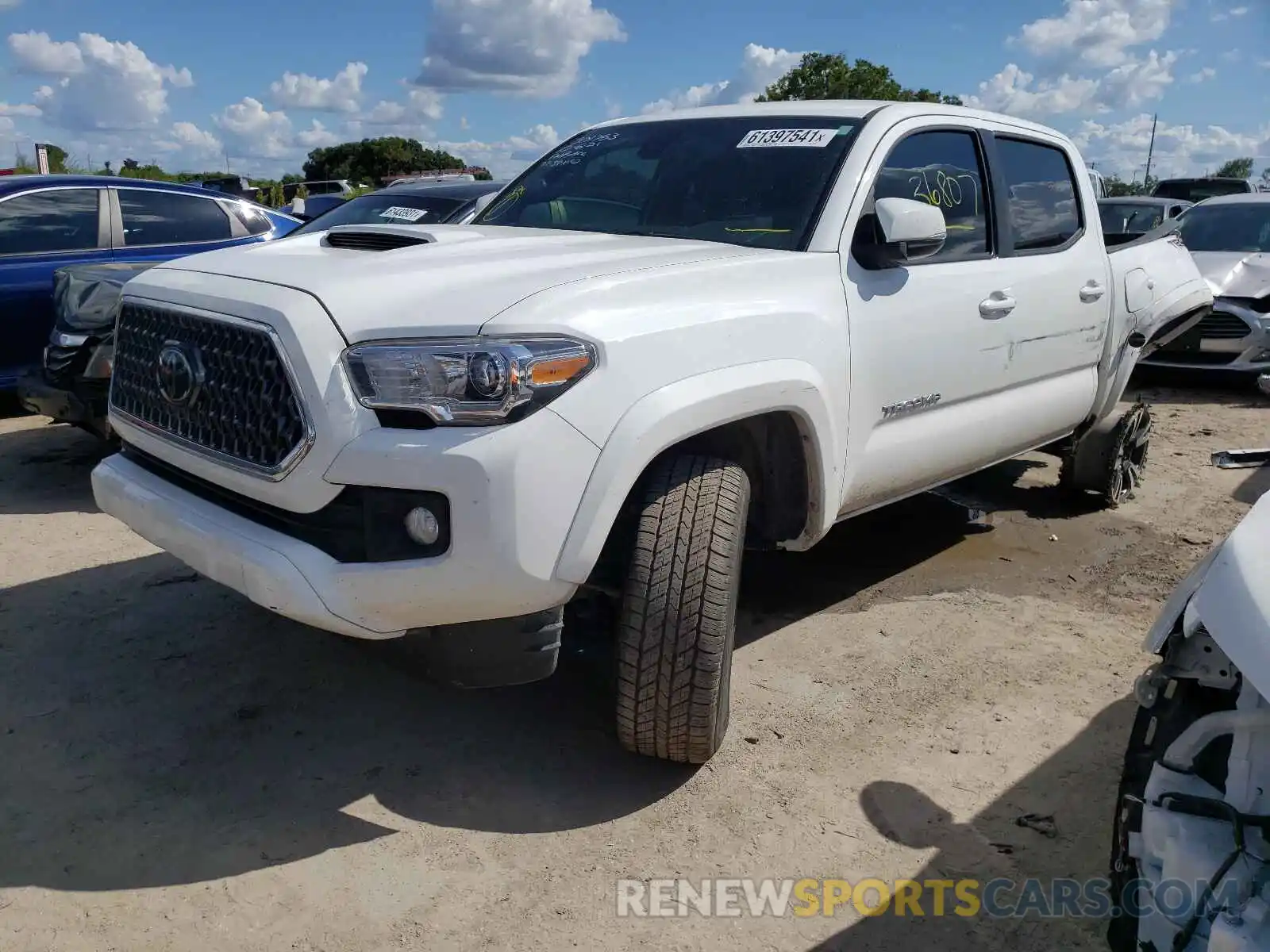 2 Photograph of a damaged car 5TFCZ5AN2KX211768 TOYOTA TACOMA 2019