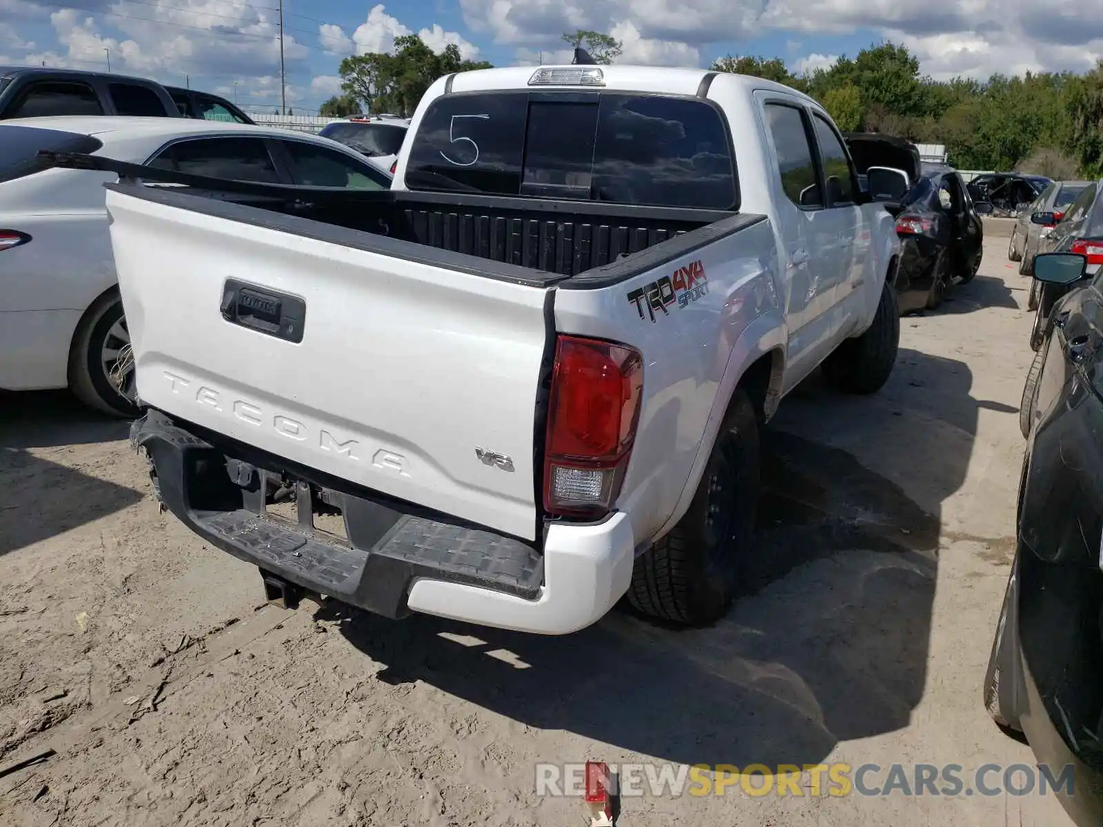 4 Photograph of a damaged car 5TFCZ5AN2KX211768 TOYOTA TACOMA 2019