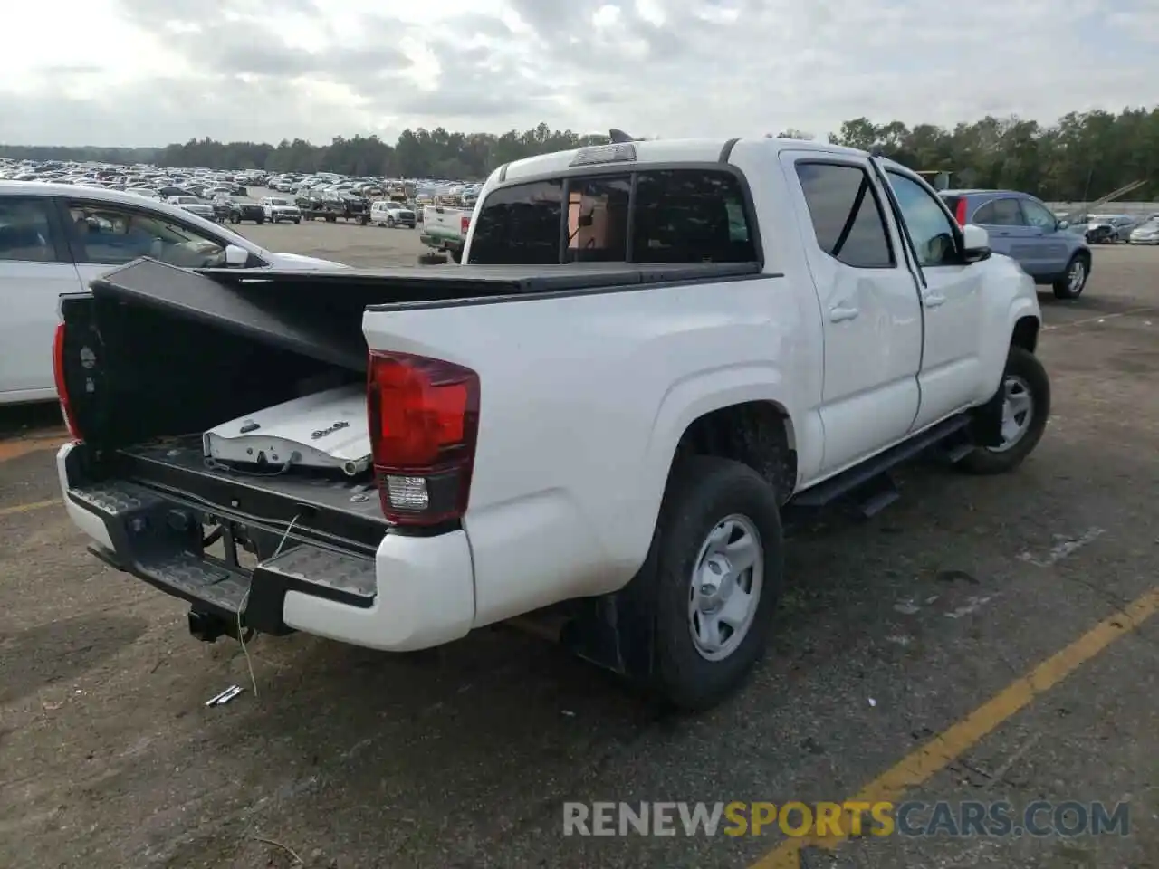 4 Photograph of a damaged car 5TFCZ5AN3KX204893 TOYOTA TACOMA 2019