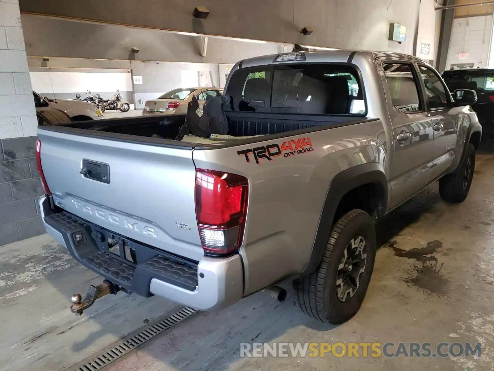 4 Photograph of a damaged car 5TFCZ5AN4KX169460 TOYOTA TACOMA 2019