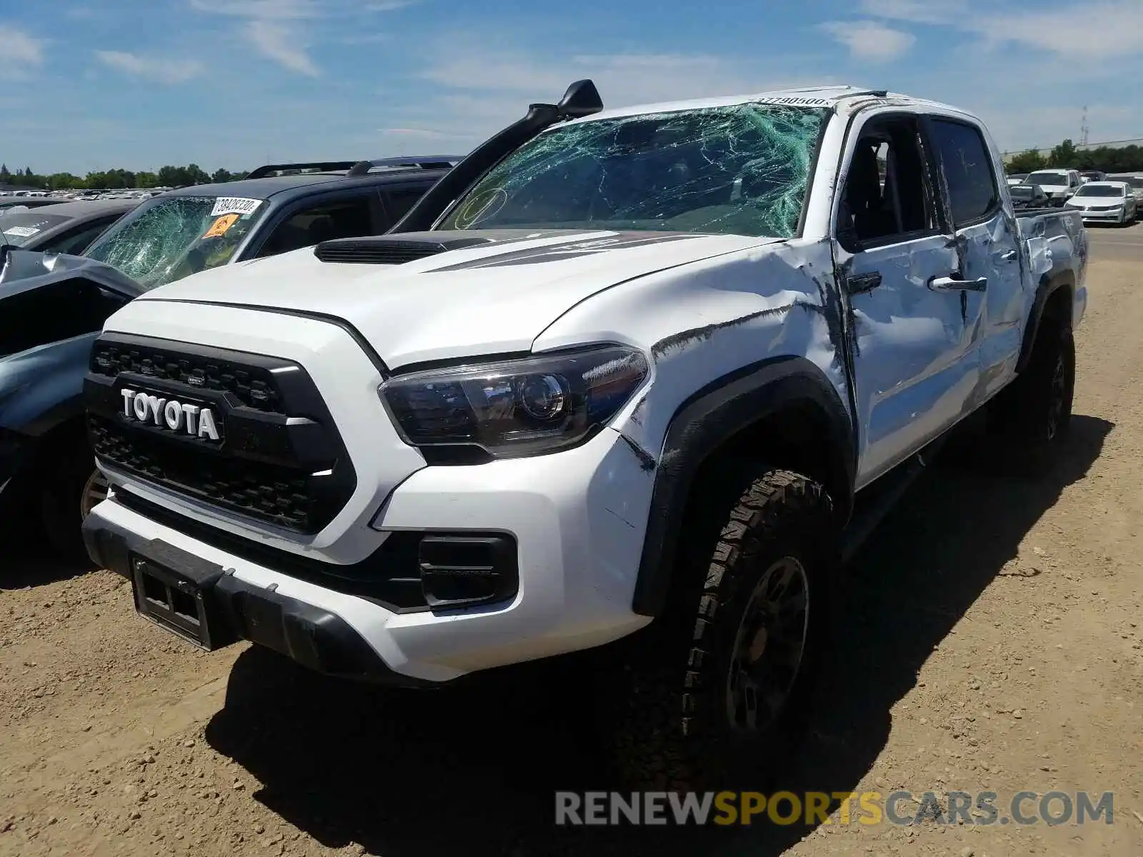 2 Photograph of a damaged car 5TFCZ5AN4KX185982 TOYOTA TACOMA 2019