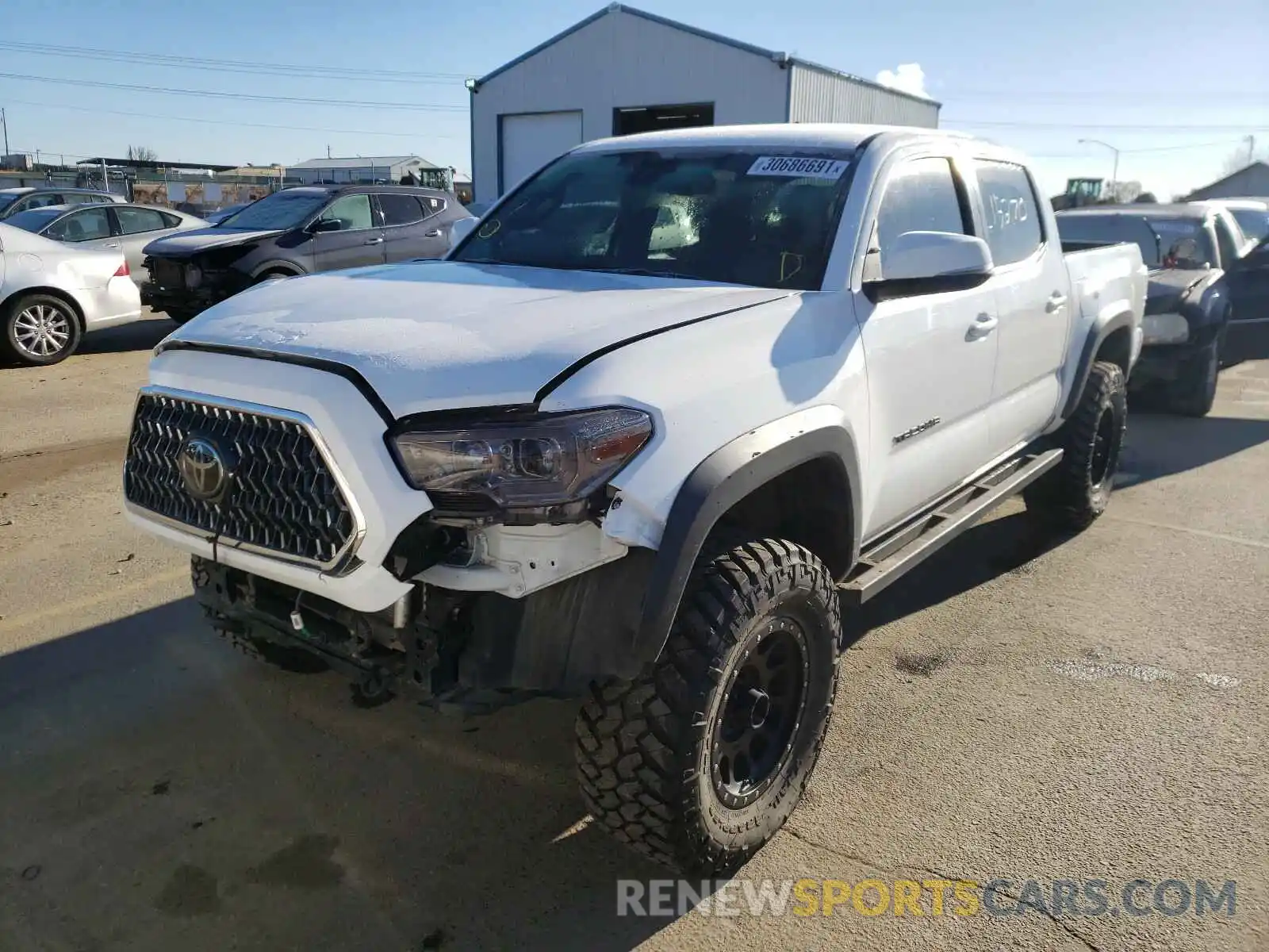 2 Photograph of a damaged car 5TFCZ5AN4KX208905 TOYOTA TACOMA 2019