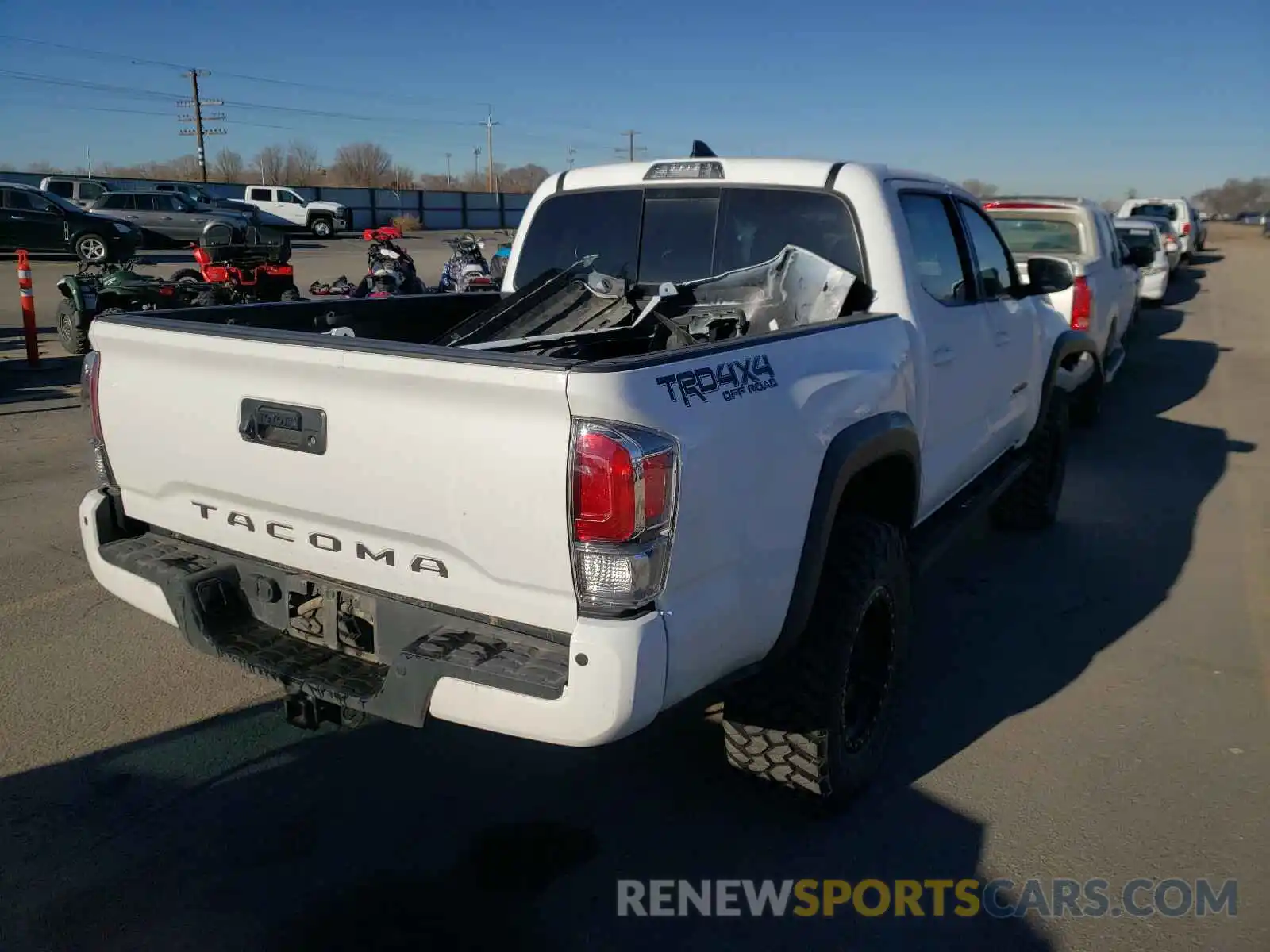 4 Photograph of a damaged car 5TFCZ5AN4KX208905 TOYOTA TACOMA 2019