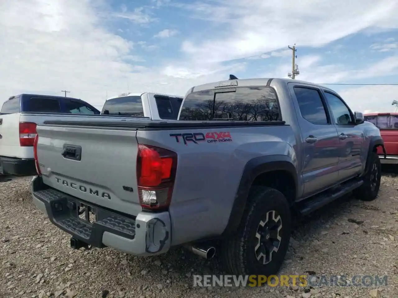 4 Photograph of a damaged car 5TFCZ5AN4KX209617 TOYOTA TACOMA 2019