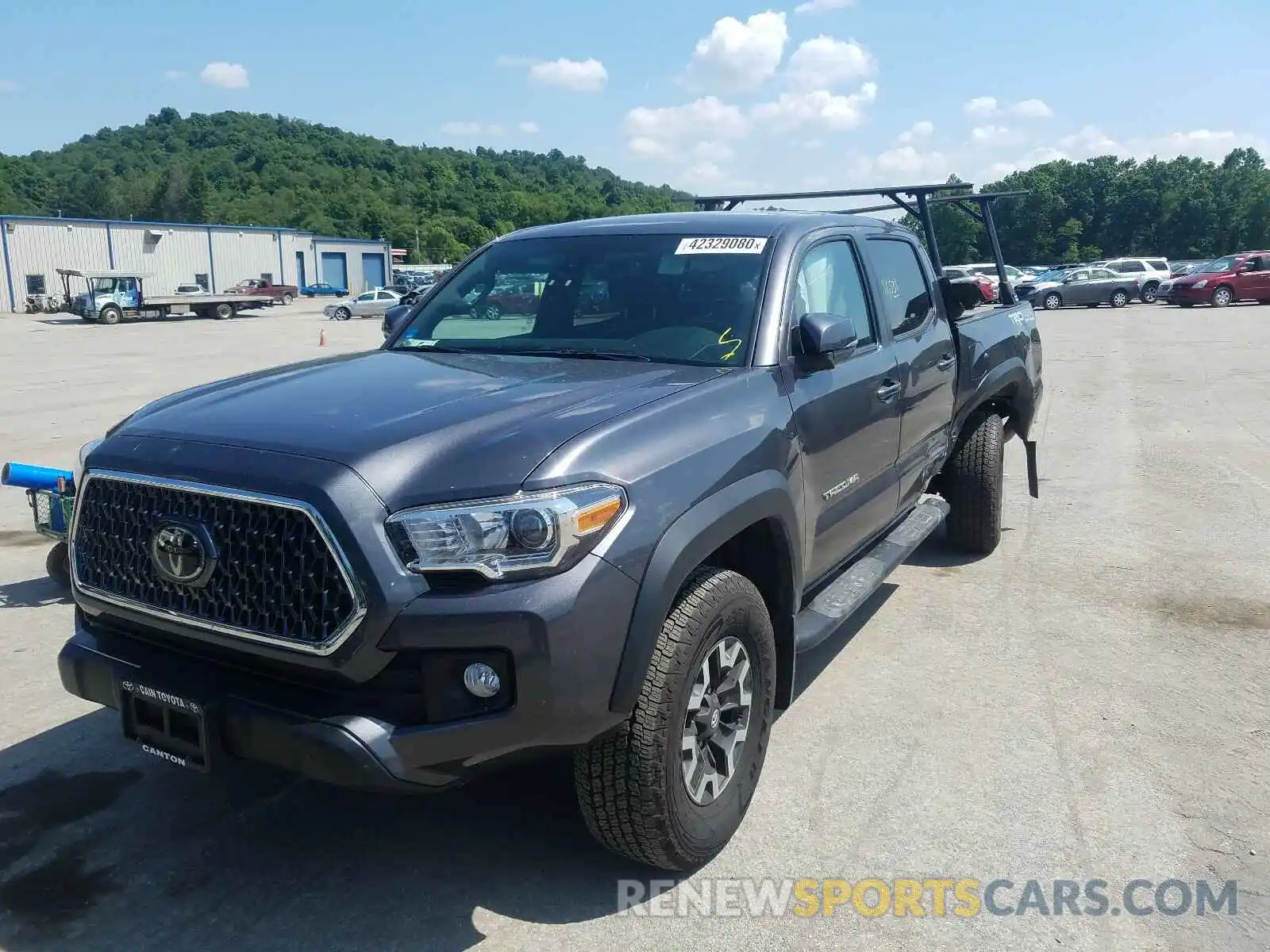 2 Photograph of a damaged car 5TFCZ5AN5KX206676 TOYOTA TACOMA 2019