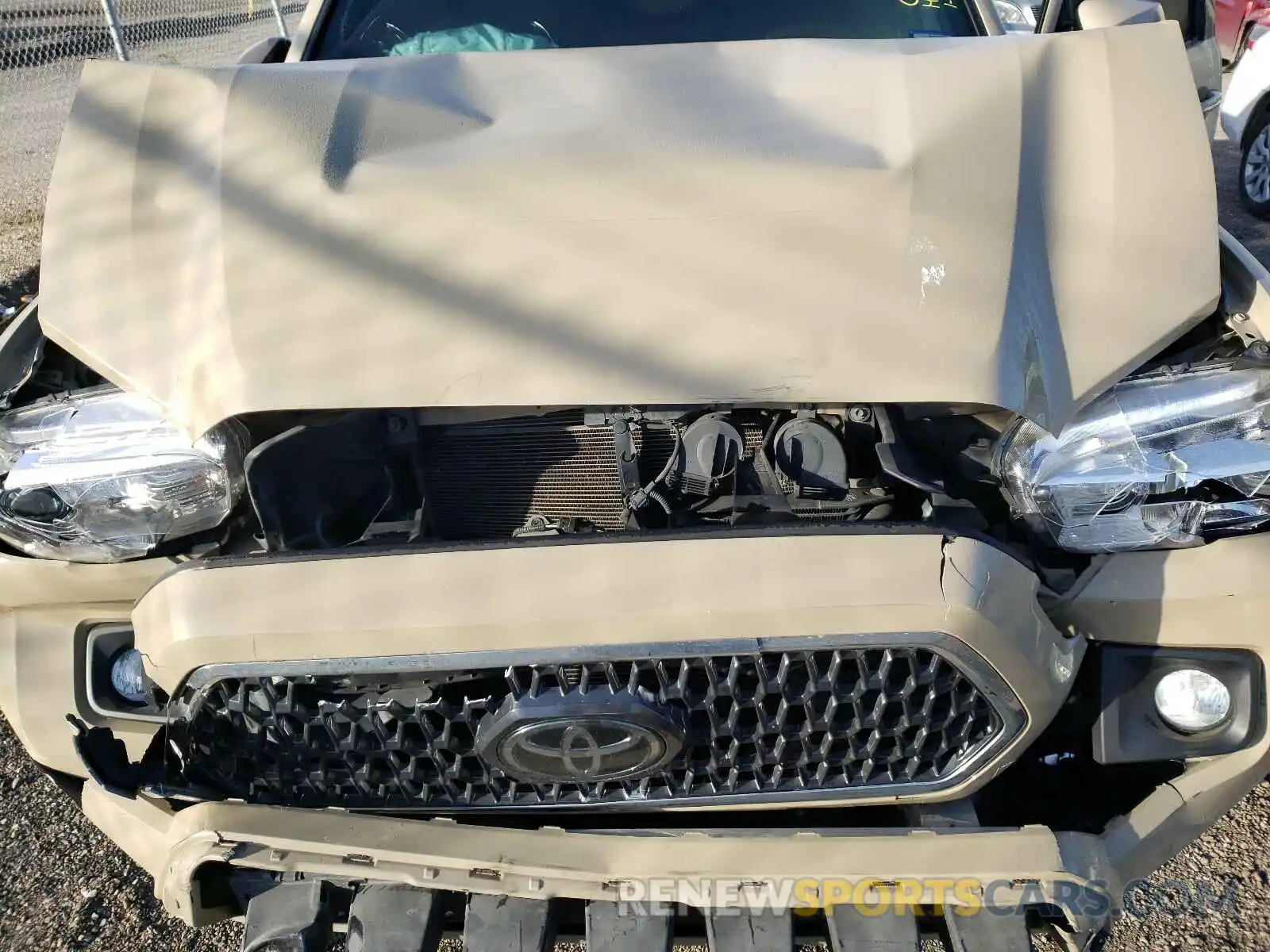 7 Photograph of a damaged car 5TFCZ5AN6KX173056 TOYOTA TACOMA 2019