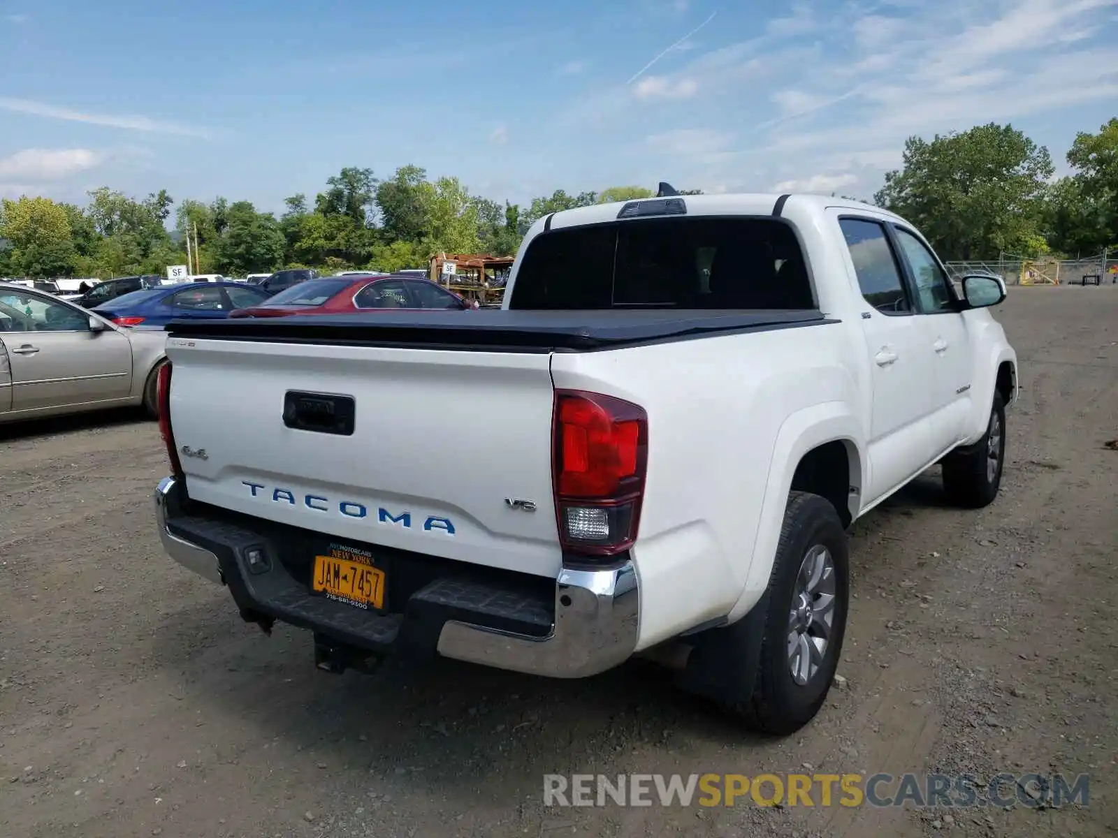 4 Photograph of a damaged car 5TFCZ5AN7KX183000 TOYOTA TACOMA 2019