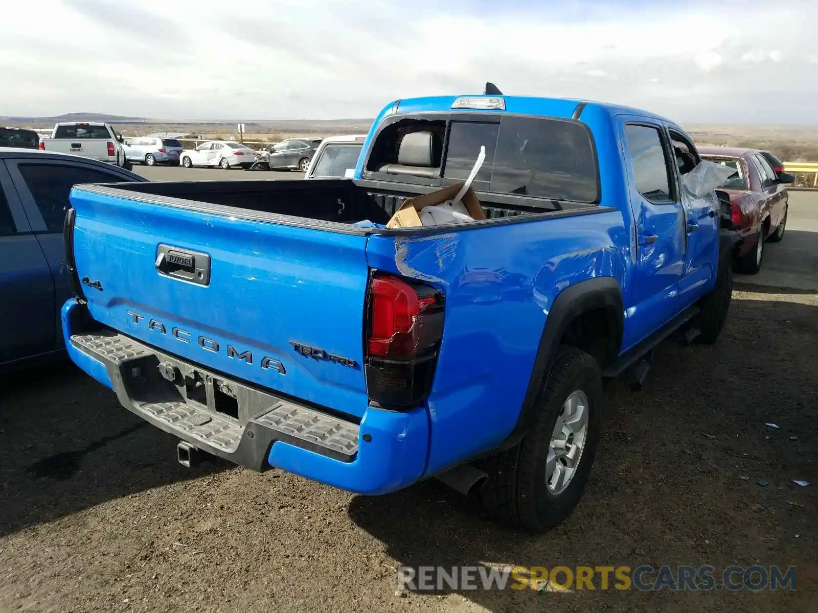 4 Photograph of a damaged car 5TFCZ5AN7KX185913 TOYOTA TACOMA 2019