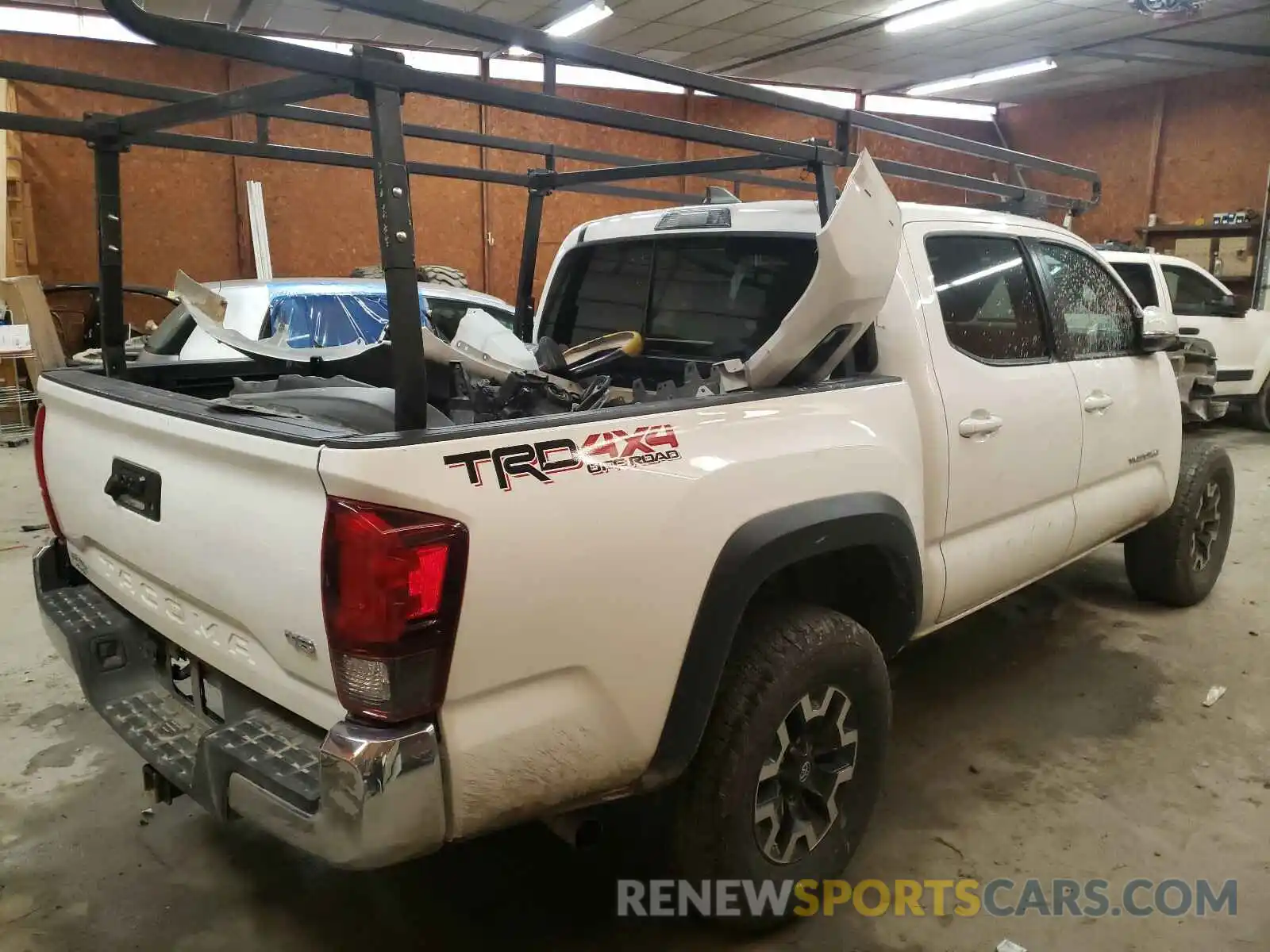 4 Photograph of a damaged car 5TFCZ5AN7KX203262 TOYOTA TACOMA 2019