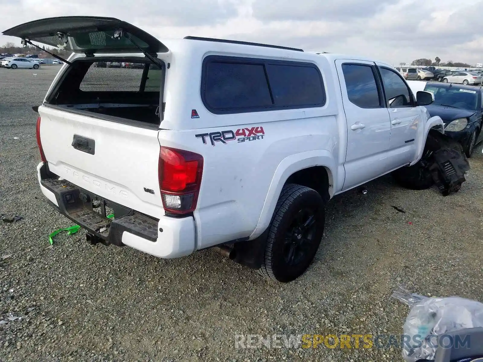 4 Photograph of a damaged car 5TFCZ5AN8KX189467 TOYOTA TACOMA 2019