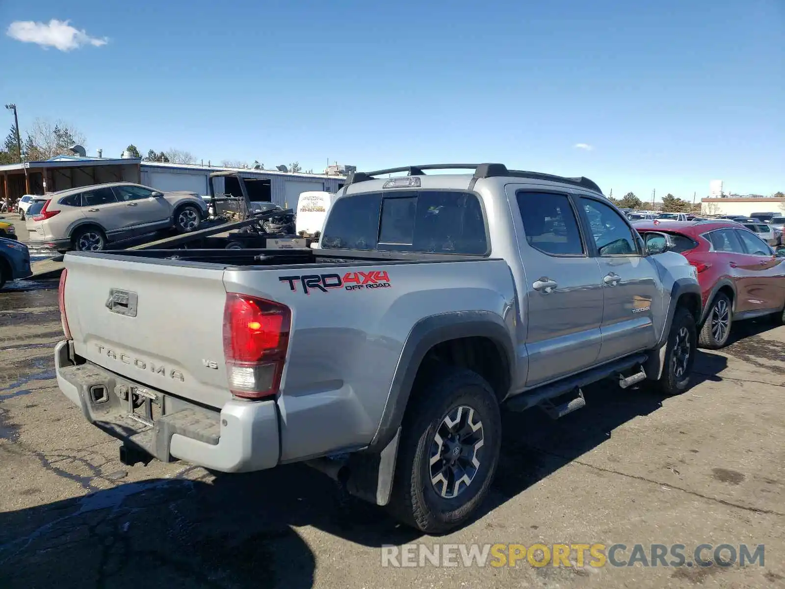 4 Photograph of a damaged car 5TFCZ5AN8KX201567 TOYOTA TACOMA 2019