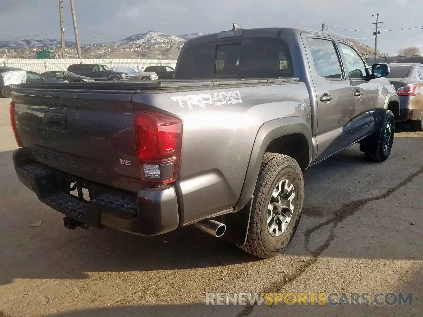 4 Photograph of a damaged car 5TFCZ5AN8KX205893 TOYOTA TACOMA 2019