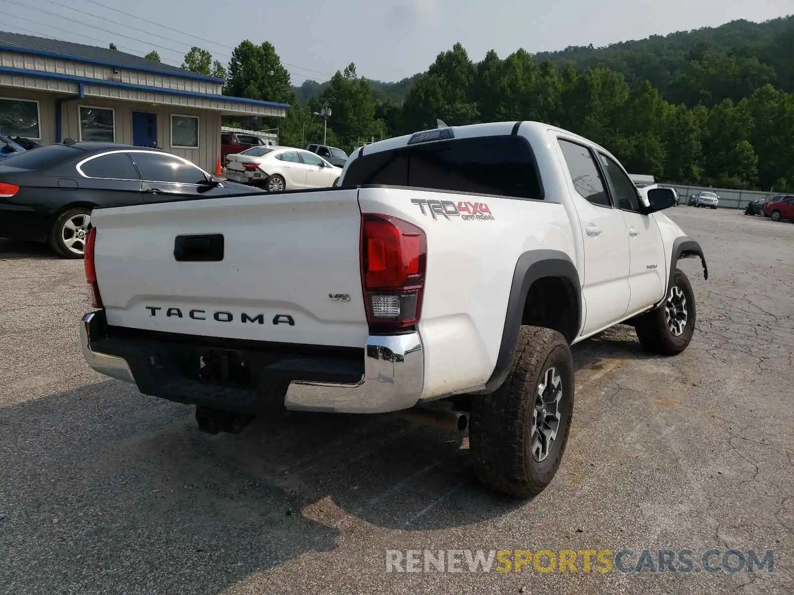 4 Photograph of a damaged car 5TFCZ5AN8KX207806 TOYOTA TACOMA 2019