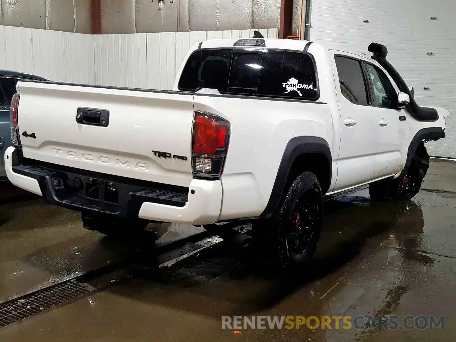 4 Photograph of a damaged car 5TFCZ5AN9KX174041 TOYOTA TACOMA 2019