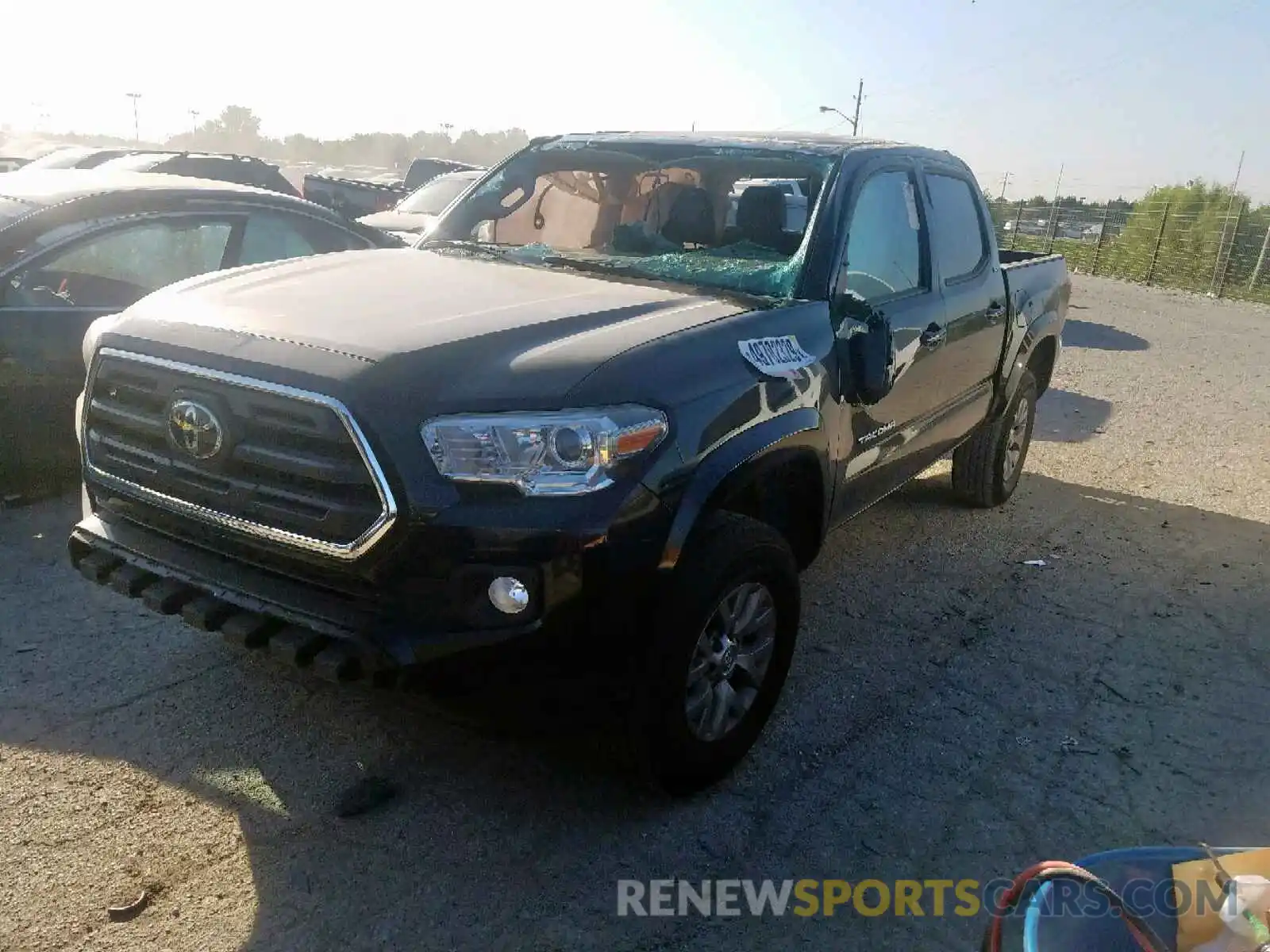 2 Photograph of a damaged car 5TFCZ5AN9KX174119 TOYOTA TACOMA 2019