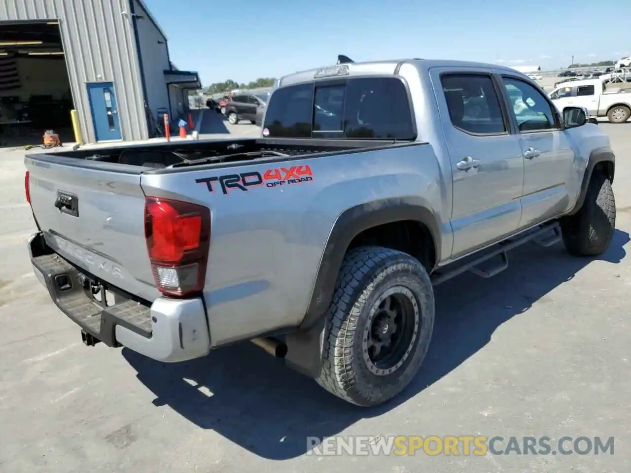 4 Photograph of a damaged car 5TFCZ5AN9KX181247 TOYOTA TACOMA 2019