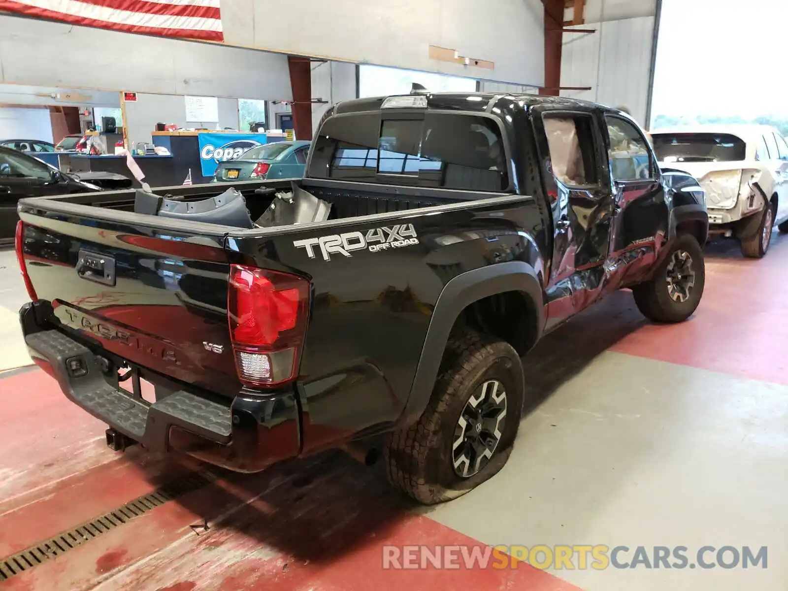 4 Photograph of a damaged car 5TFCZ5AN9KX195472 TOYOTA TACOMA 2019