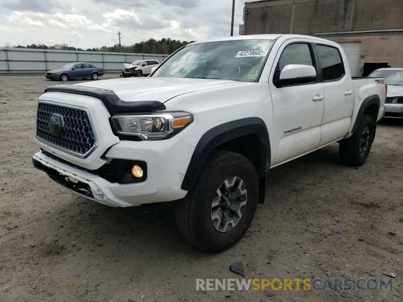 2 Photograph of a damaged car 5TFCZ5AN9KX210973 TOYOTA TACOMA 2019