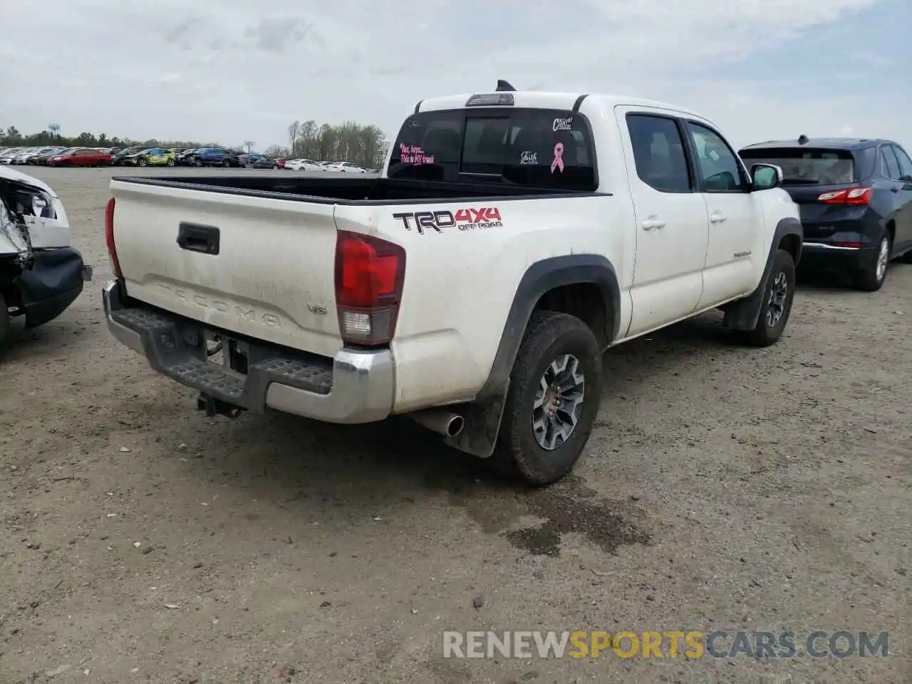 4 Photograph of a damaged car 5TFCZ5AN9KX210973 TOYOTA TACOMA 2019