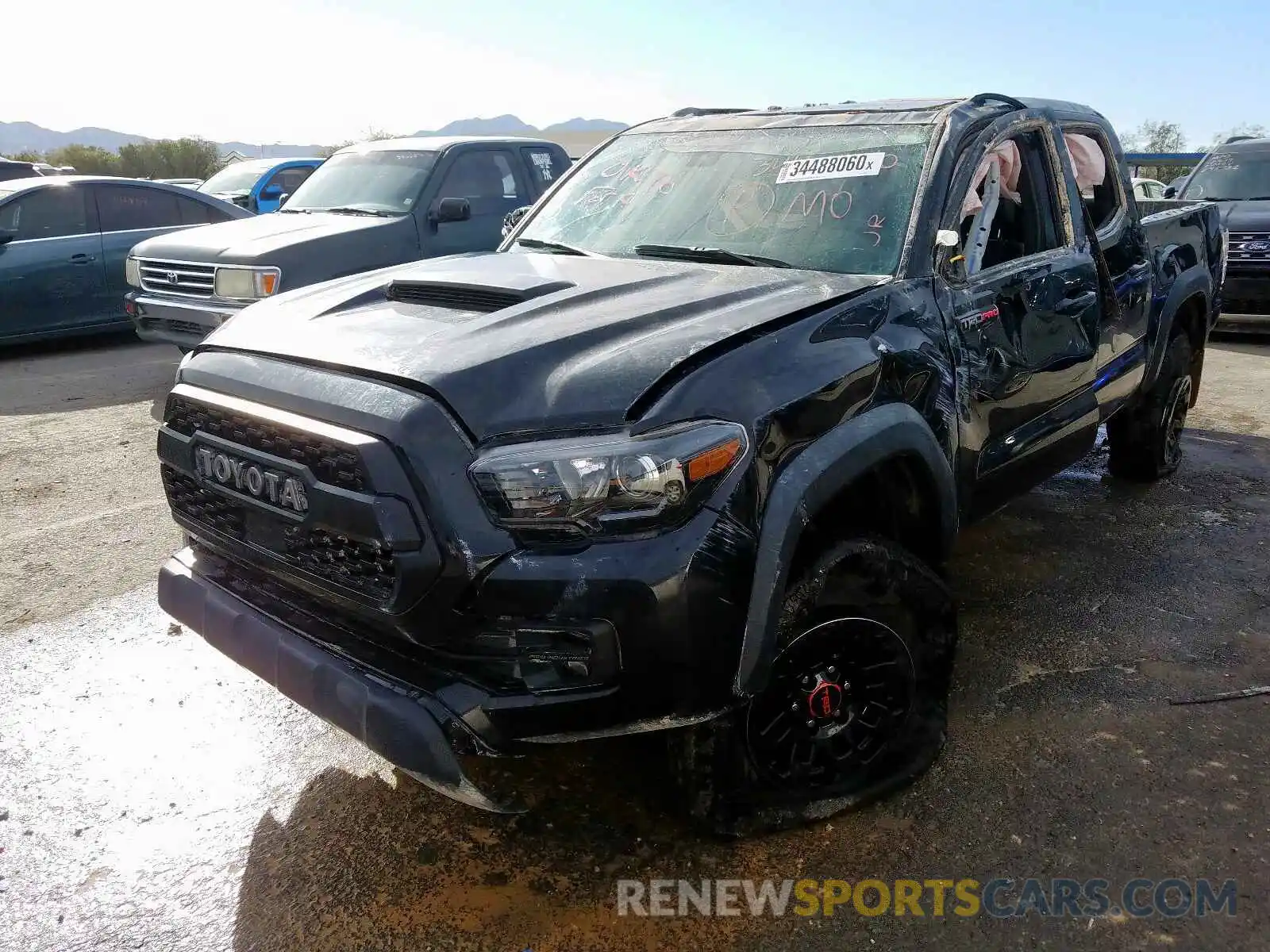 2 Photograph of a damaged car 5TFCZ5AN9KX211511 TOYOTA TACOMA 2019