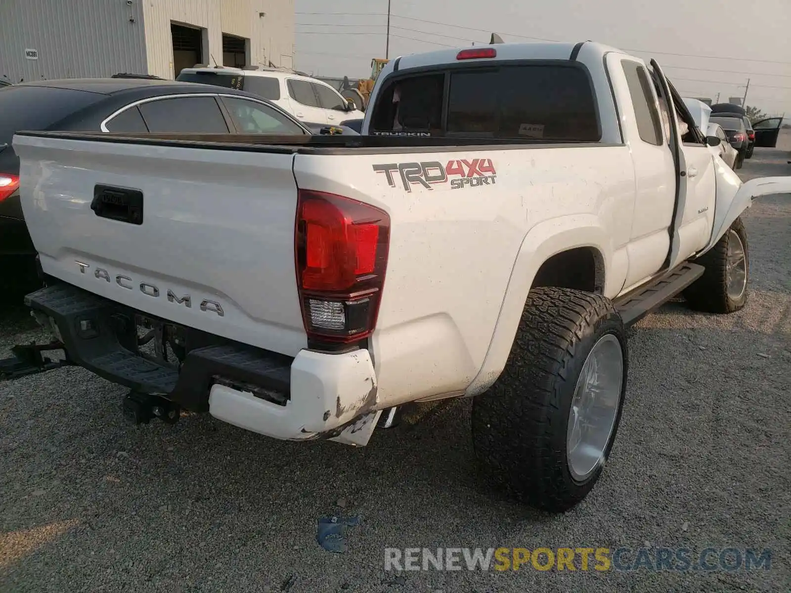 4 Photograph of a damaged car 5TFSZ5AN0KX180600 TOYOTA TACOMA 2019