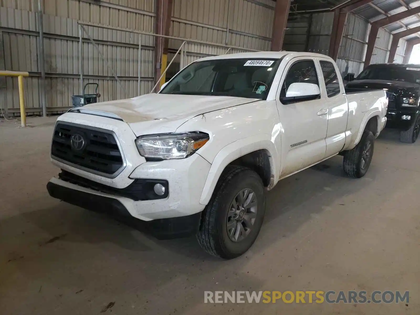 2 Photograph of a damaged car 5TFSZ5AN2KX174295 TOYOTA TACOMA 2019