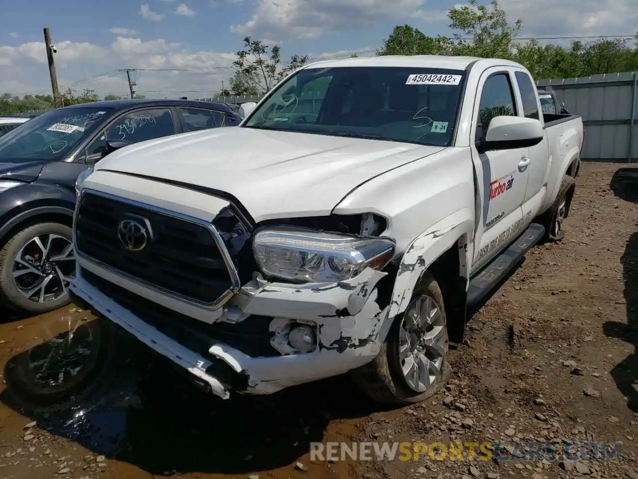 2 Photograph of a damaged car 5TFSZ5AN2KX202709 TOYOTA TACOMA 2019