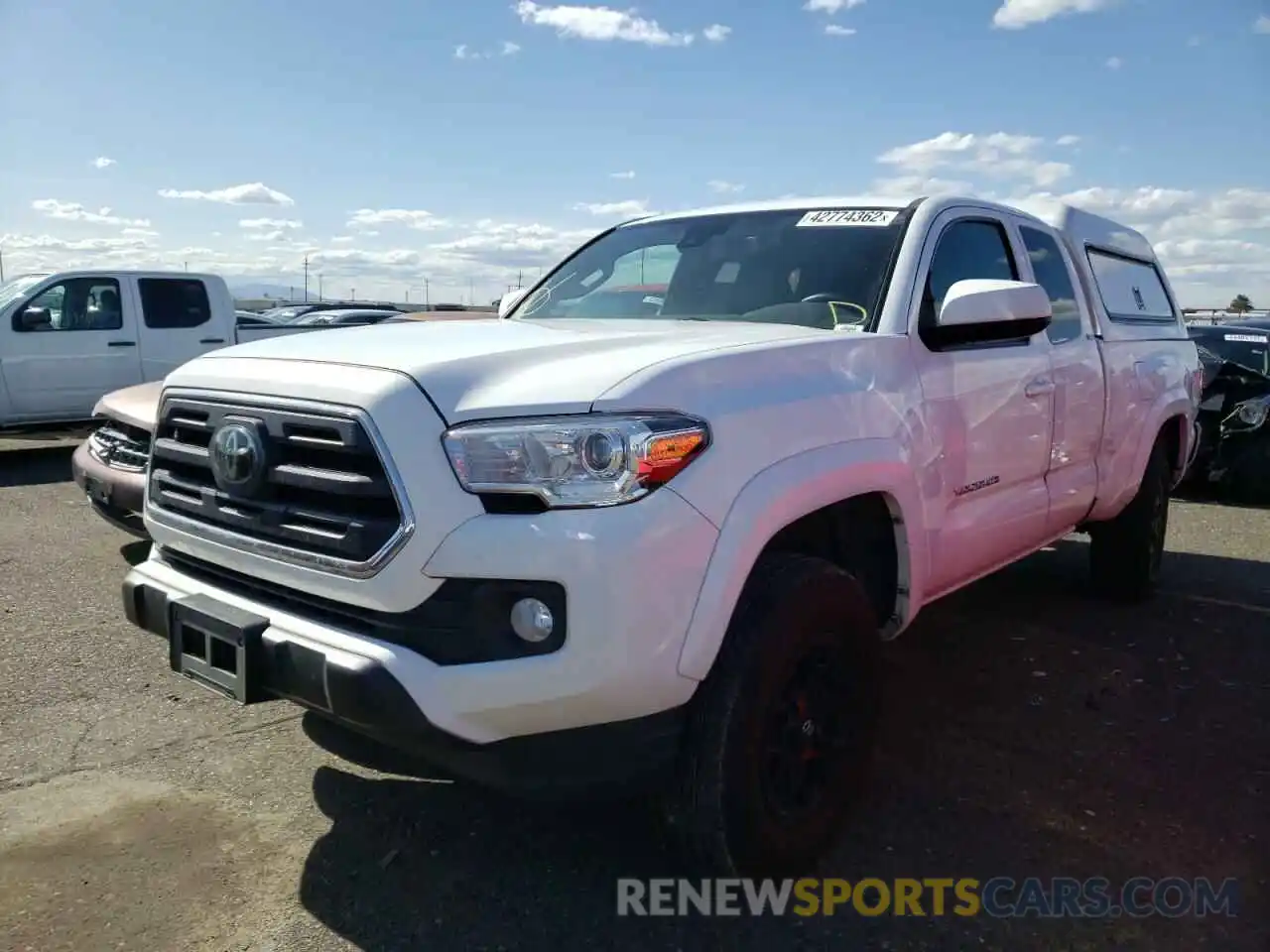 2 Photograph of a damaged car 5TFSZ5AN4KX181765 TOYOTA TACOMA 2019