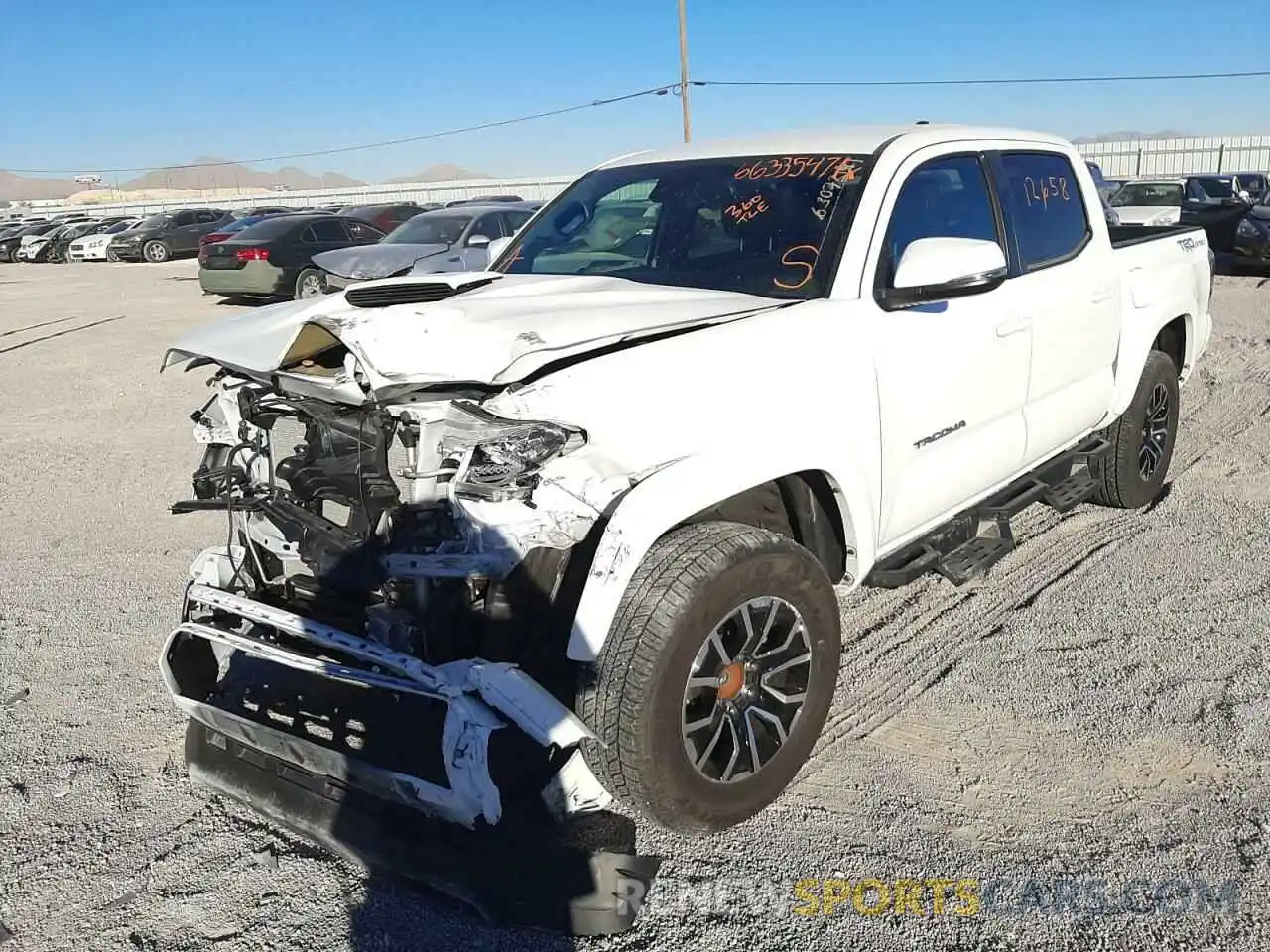 2 Photograph of a damaged car 3TMAZ5CN5LM137158 TOYOTA TACOMA 2020