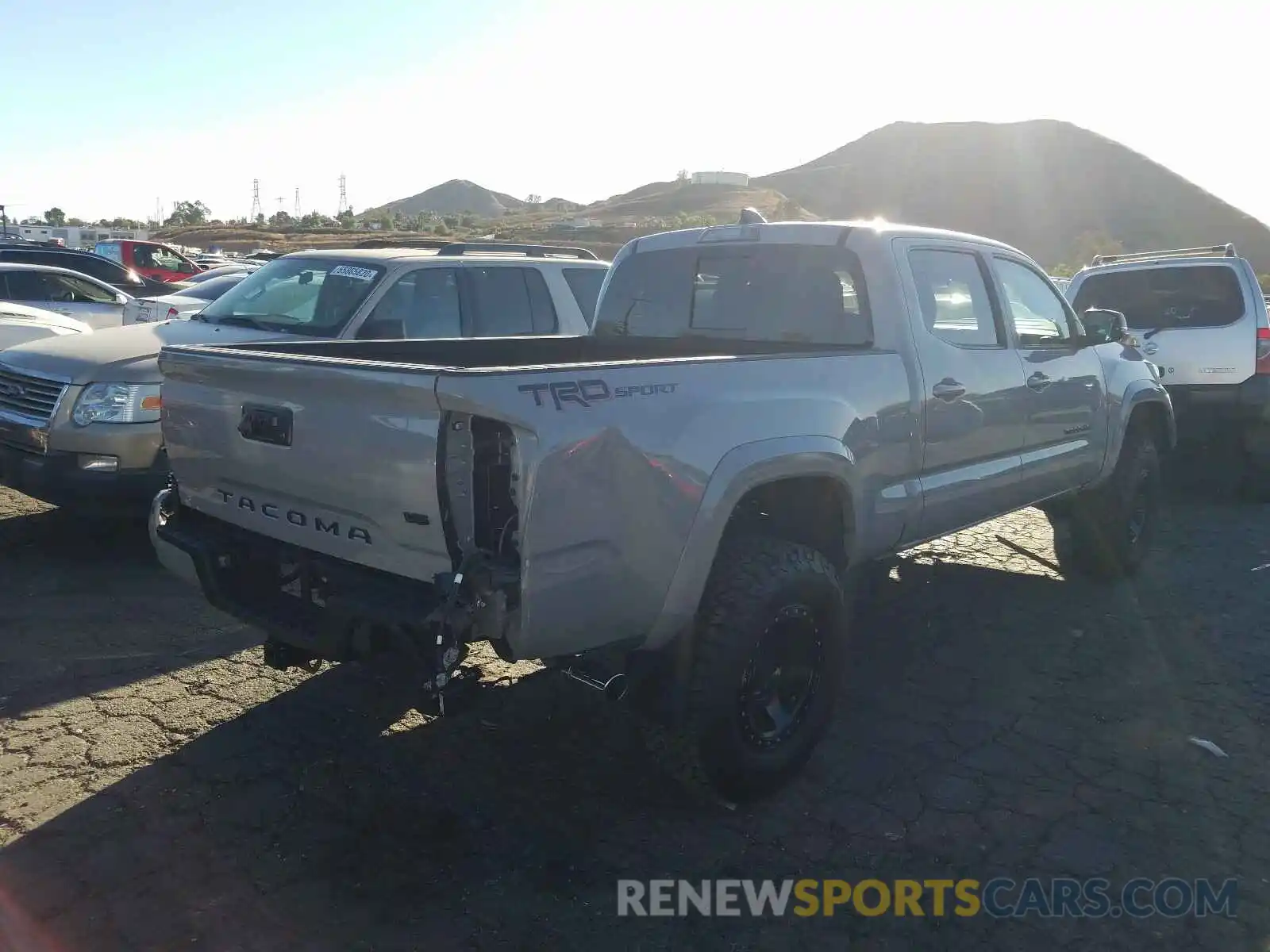 4 Photograph of a damaged car 3TMBZ5DN2LM024111 TOYOTA TACOMA 2020