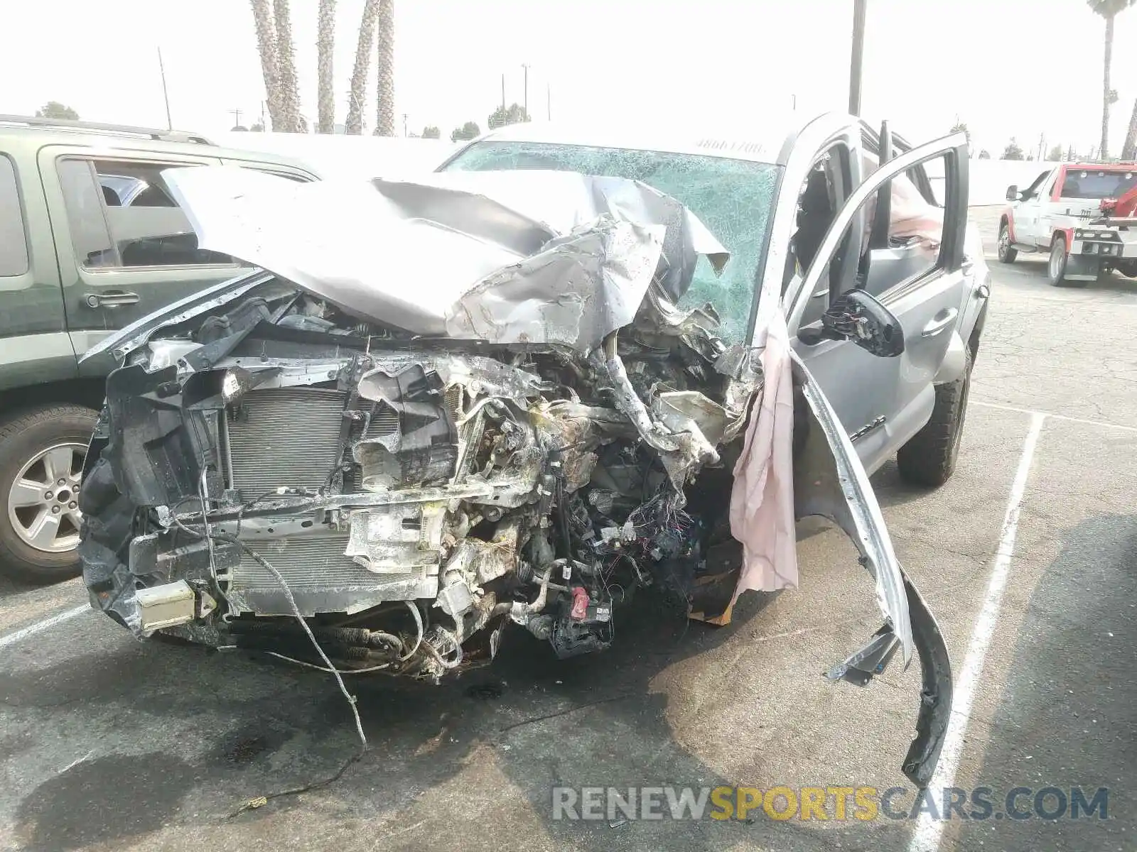 2 Photograph of a damaged car 5TFAZ5CN9LX089612 TOYOTA TACOMA 2020