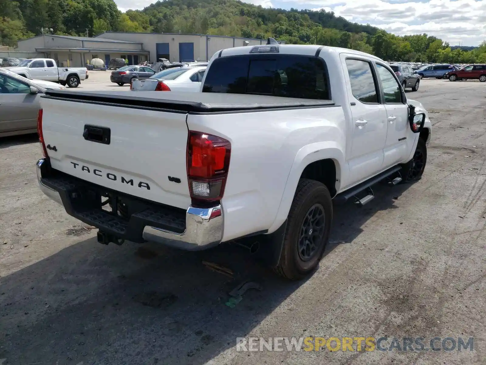 4 Photograph of a damaged car 3TYCZ5AN9MT044354 TOYOTA TACOMA 2021