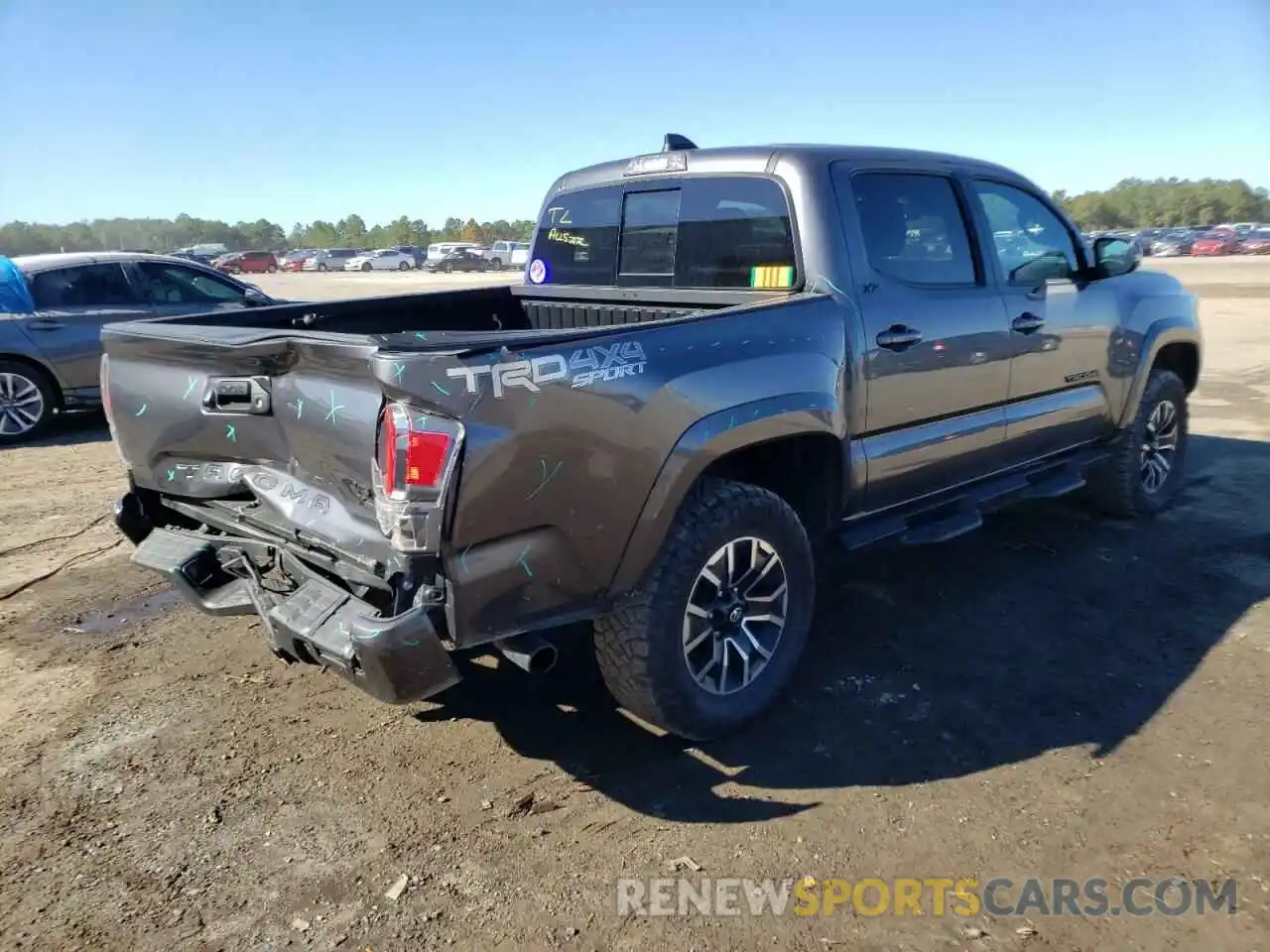 4 Photograph of a damaged car 5TFCZ5AN4MX259890 TOYOTA TACOMA 2021