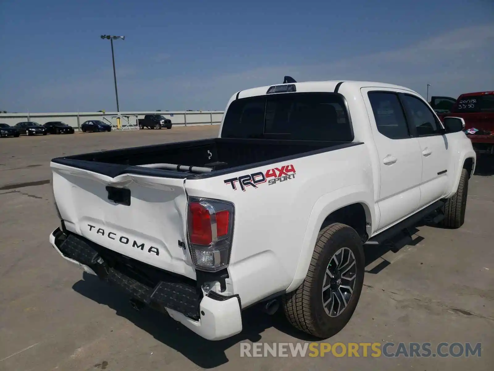 4 Photograph of a damaged car 5TFCZ5AN4MX265284 TOYOTA TACOMA 2021