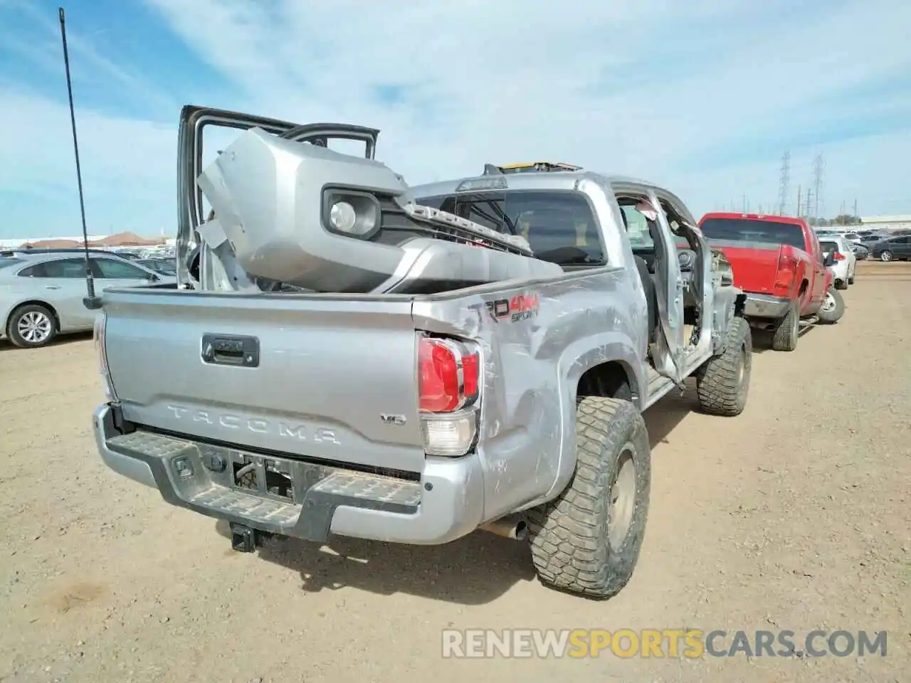 4 Photograph of a damaged car 5TFCZ5AN9MX245886 TOYOTA TACOMA 2021