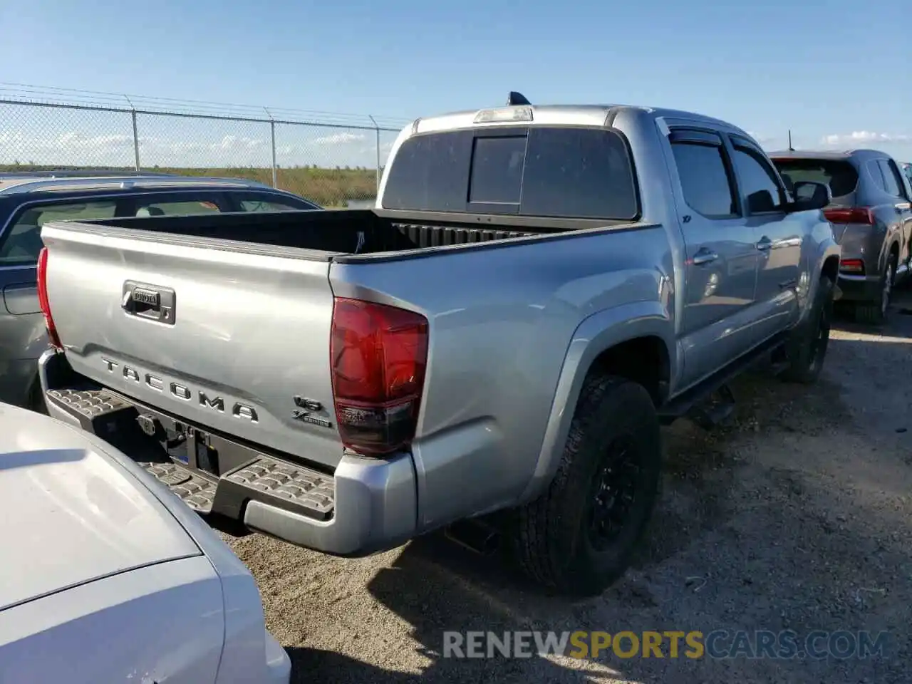 4 Photograph of a damaged car 3TMAZ5CN0NM181460 TOYOTA TACOMA 2022