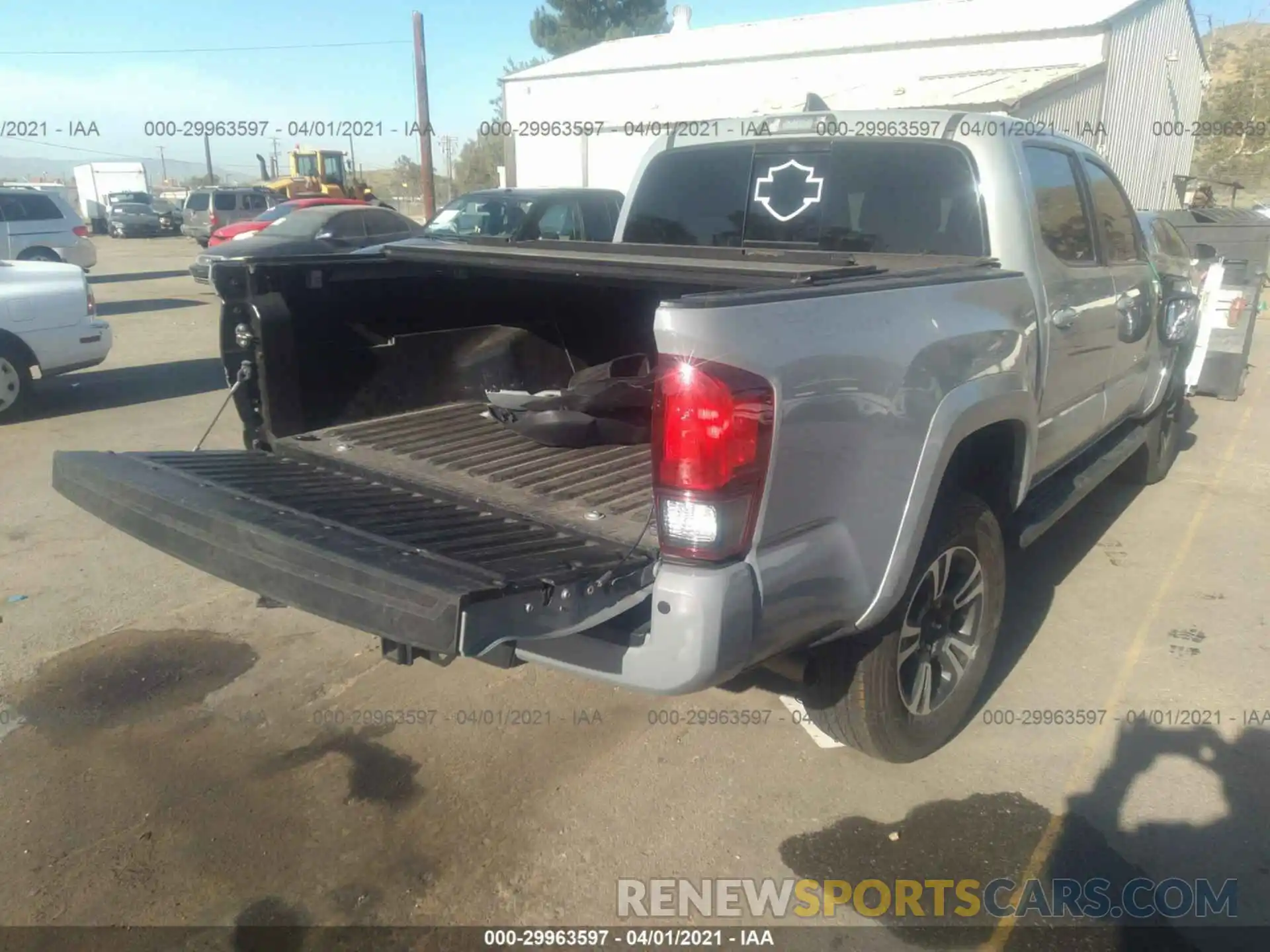 4 Photograph of a damaged car 3TMAZ5CN0KM114224 TOYOTA TACOMA 2WD 2019