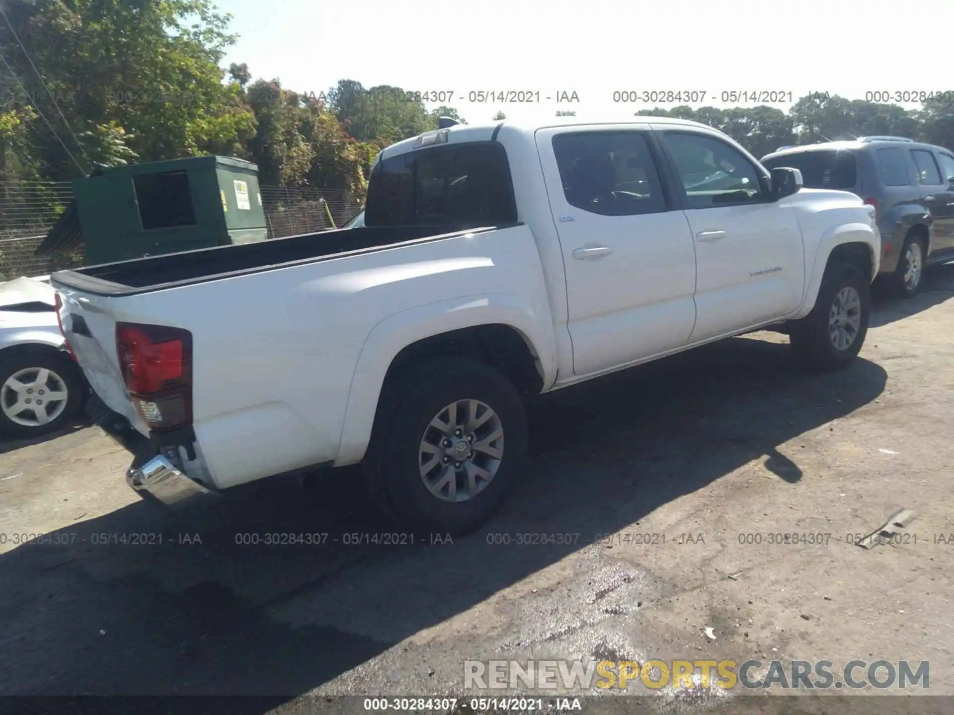 4 Photograph of a damaged car 3TMAZ5CN1KM102373 TOYOTA TACOMA 2WD 2019