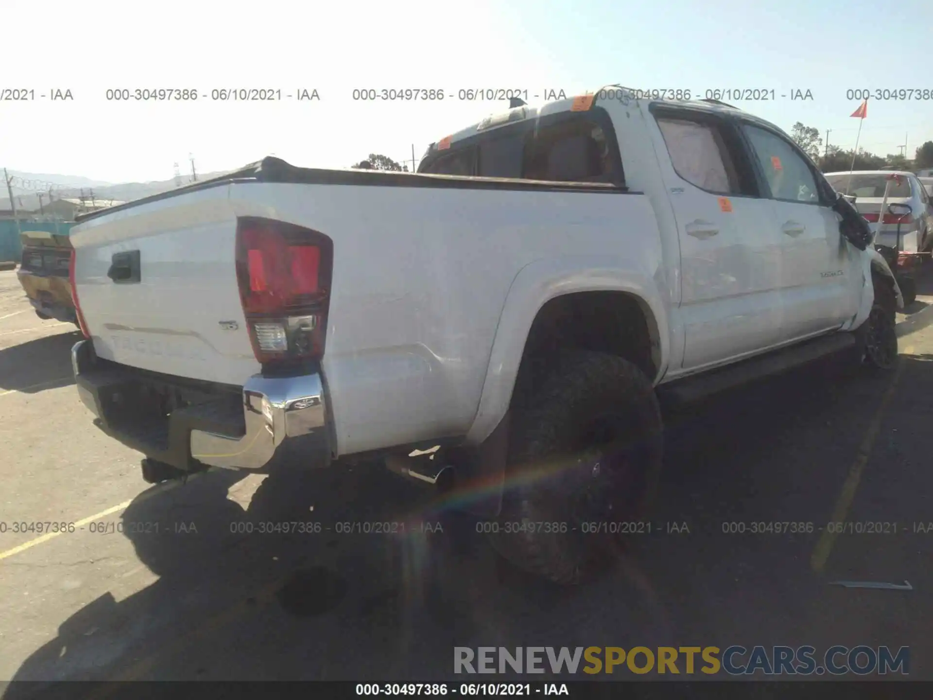 4 Photograph of a damaged car 3TMAZ5CN6KM099180 TOYOTA TACOMA 2WD 2019