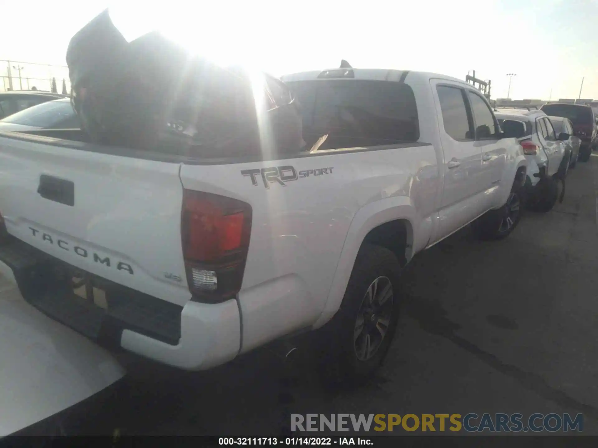 4 Photograph of a damaged car 3TMBZ5DNXKM020886 TOYOTA TACOMA 2WD 2019