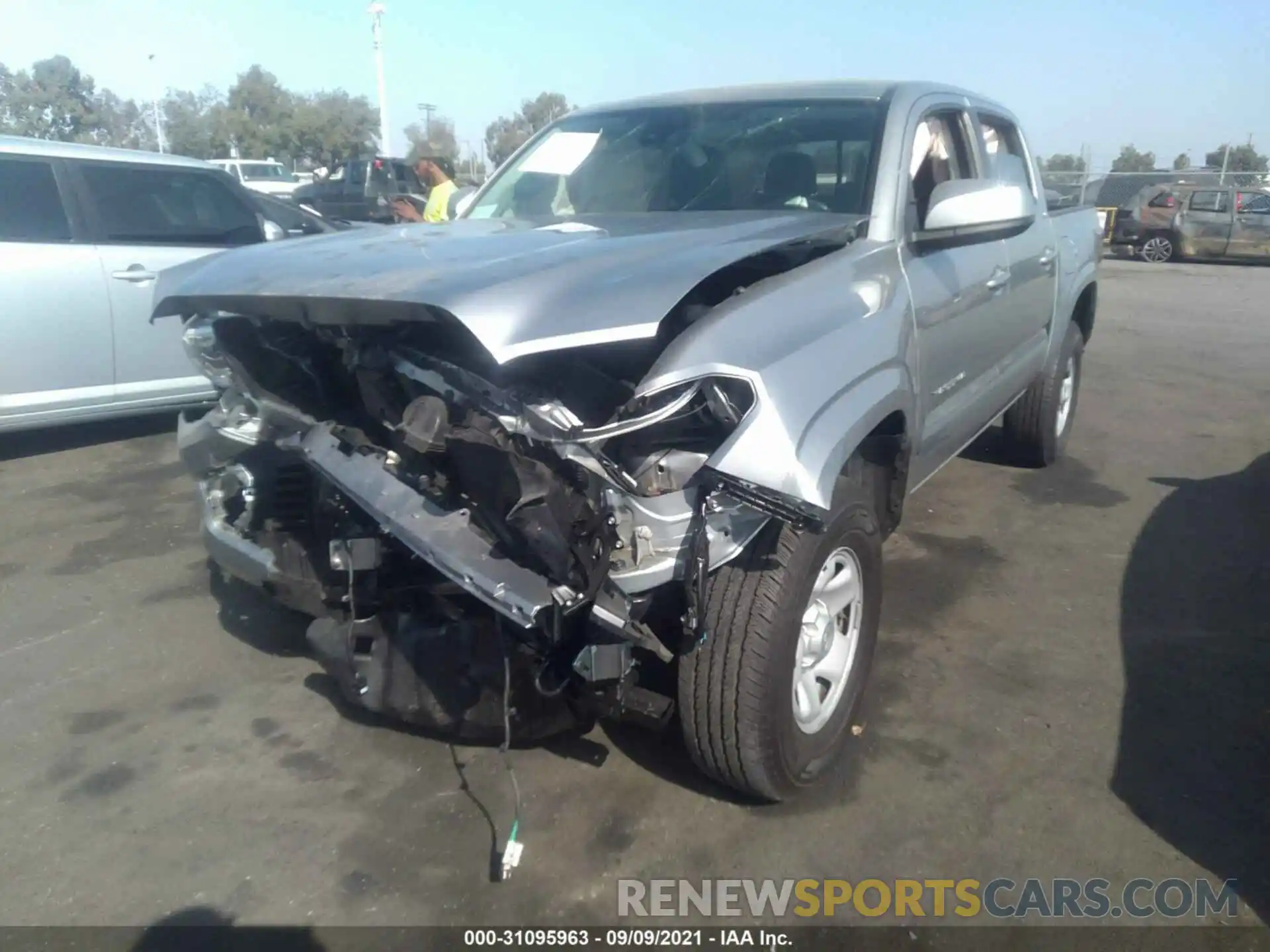 2 Photograph of a damaged car 5TFAX5GN3KX149396 TOYOTA TACOMA 2WD 2019