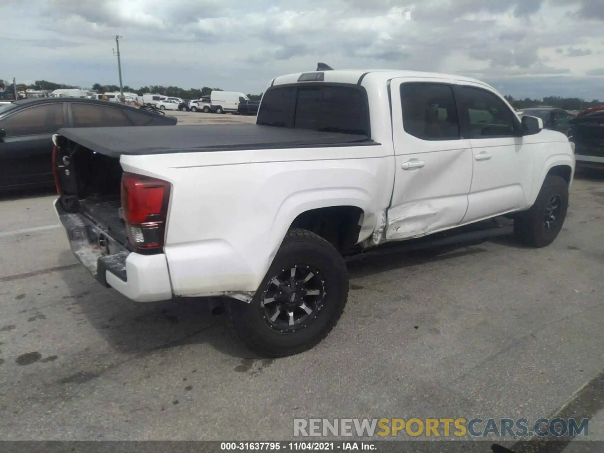 4 Photograph of a damaged car 5TFAX5GN5KX145625 TOYOTA TACOMA 2WD 2019