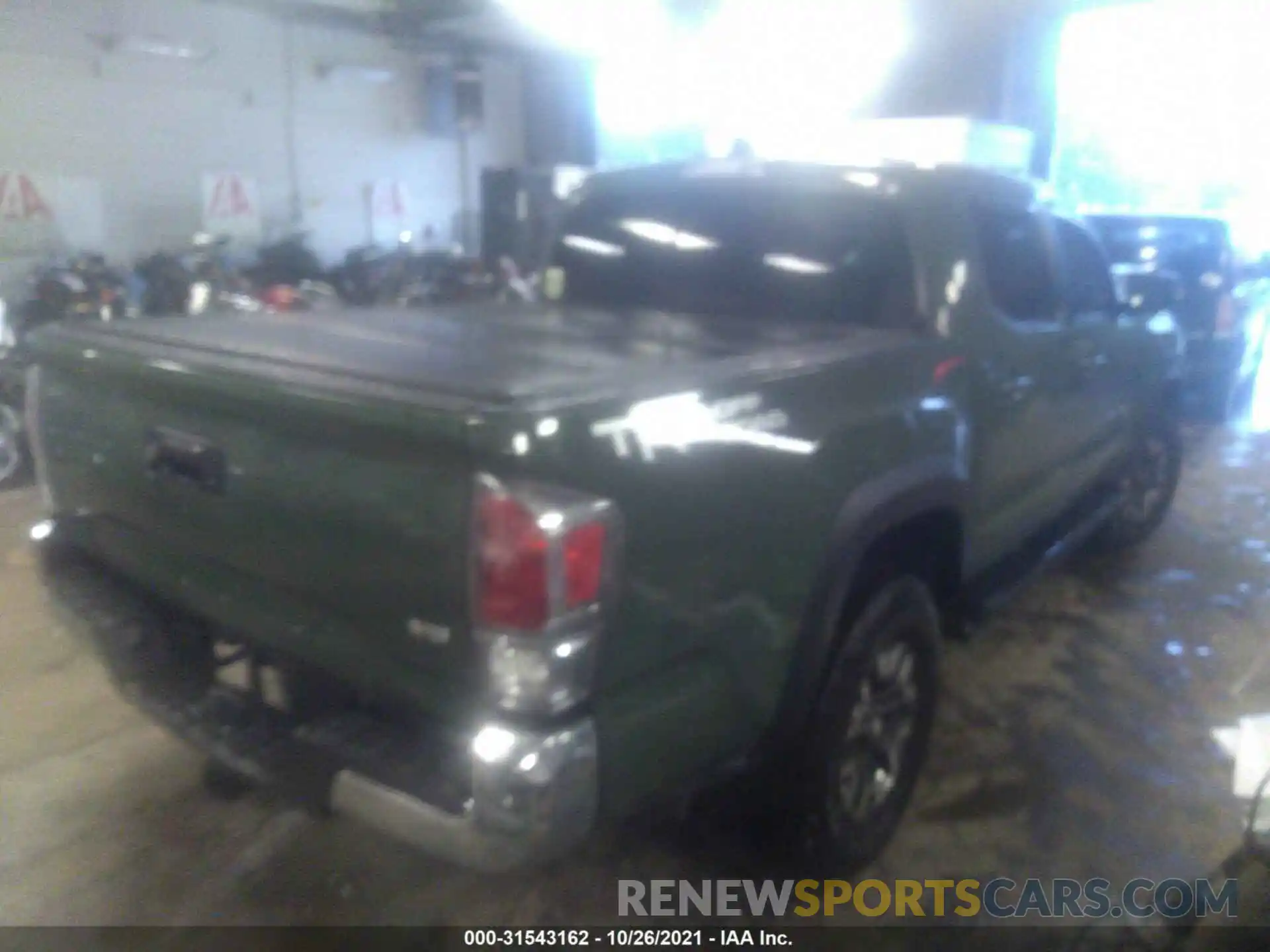 4 Photograph of a damaged car 3TMAZ5CN5MM149361 TOYOTA TACOMA 2WD 2021