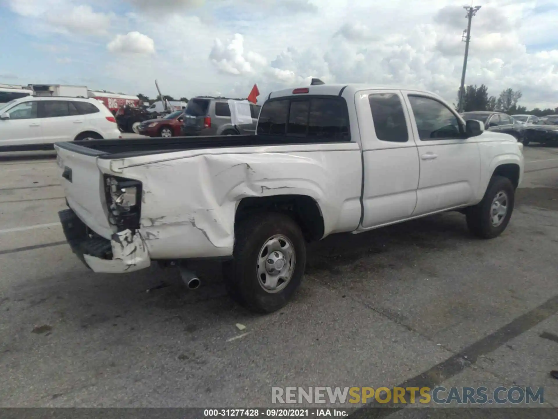 4 Photograph of a damaged car 3TYRX5GN9MT009143 TOYOTA TACOMA 2WD 2021