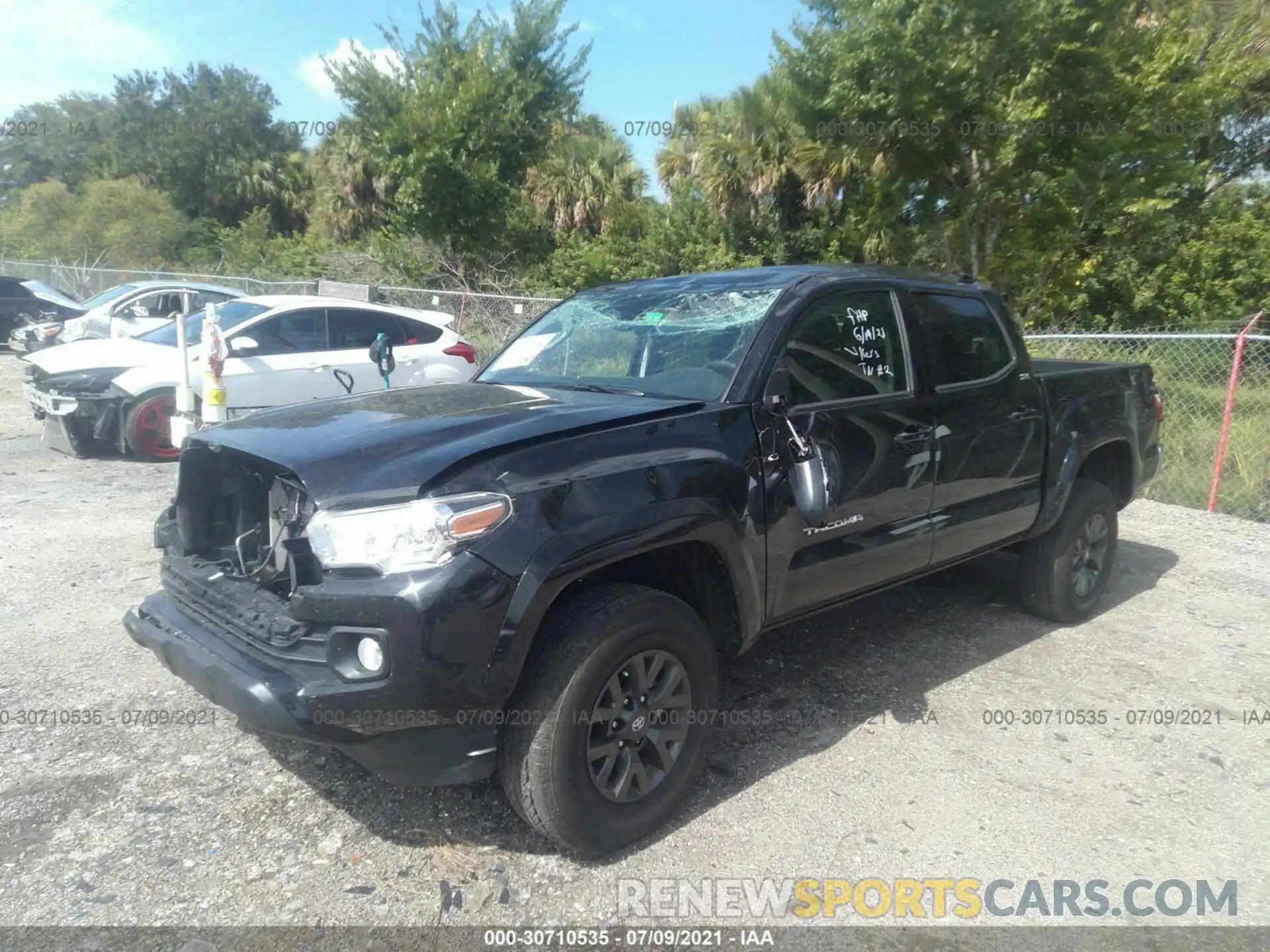 2 Photograph of a damaged car 5TFAZ5CN5MX102566 TOYOTA TACOMA 2WD 2021