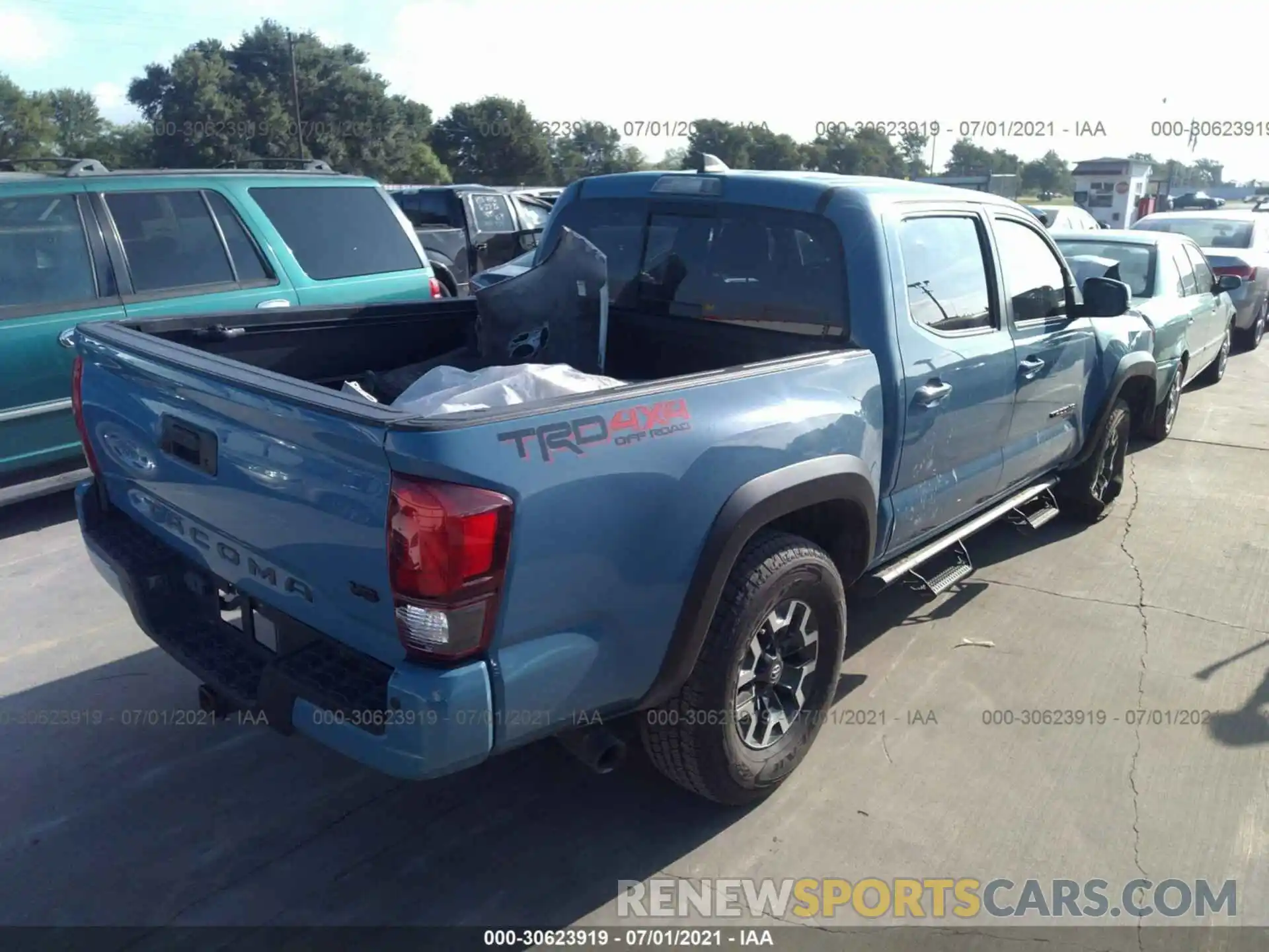 4 Photograph of a damaged car 3TMCZ5AN1KM251572 TOYOTA TACOMA 4WD 2019