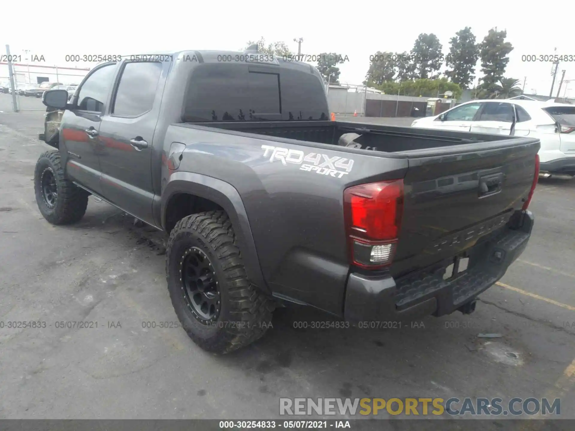 3 Photograph of a damaged car 3TMCZ5AN1KM275337 TOYOTA TACOMA 4WD 2019